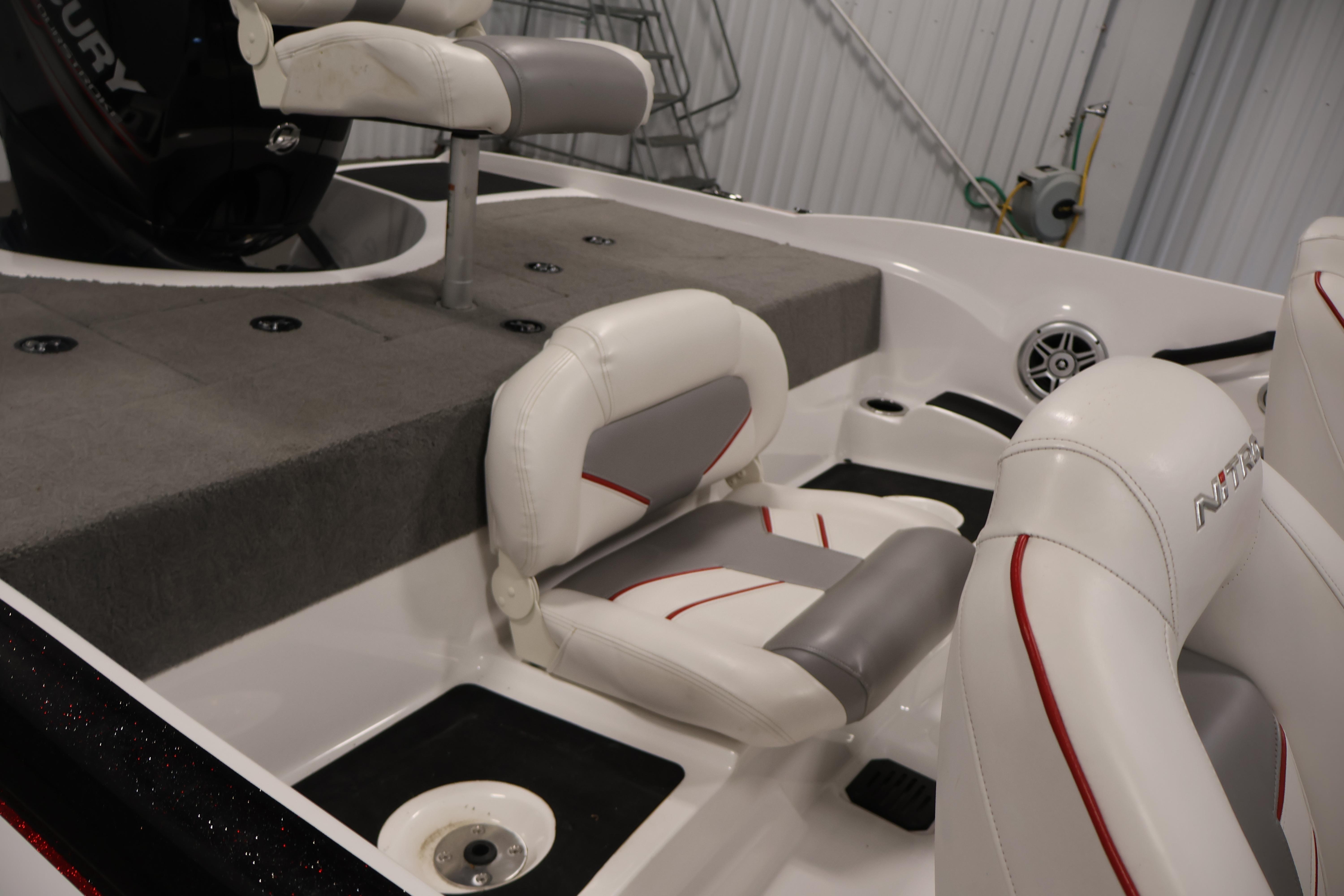 2019 Nitro Z19 Sport boat interior with white and gray seating, featuring red accents.