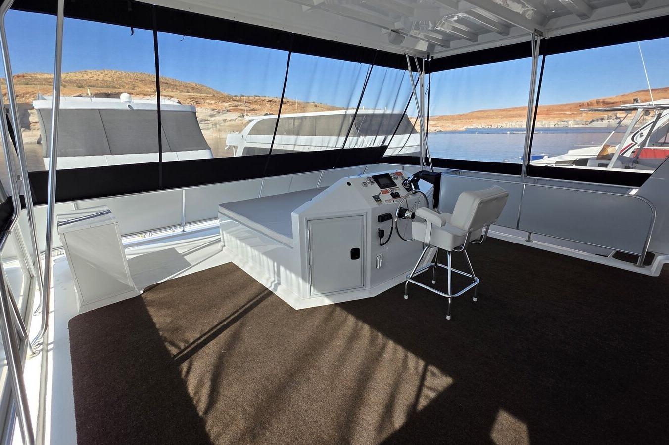 Luxurious 2025 Sumerset Excellence Multiple Shares houseboat interior with helm and panoramic views.