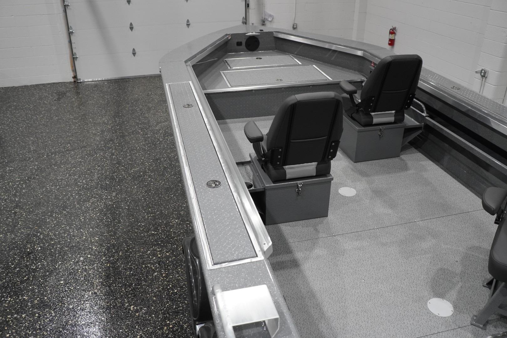 Interior of 2026 Thunder Jet 209 Rush OT boat with seating and storage compartments.