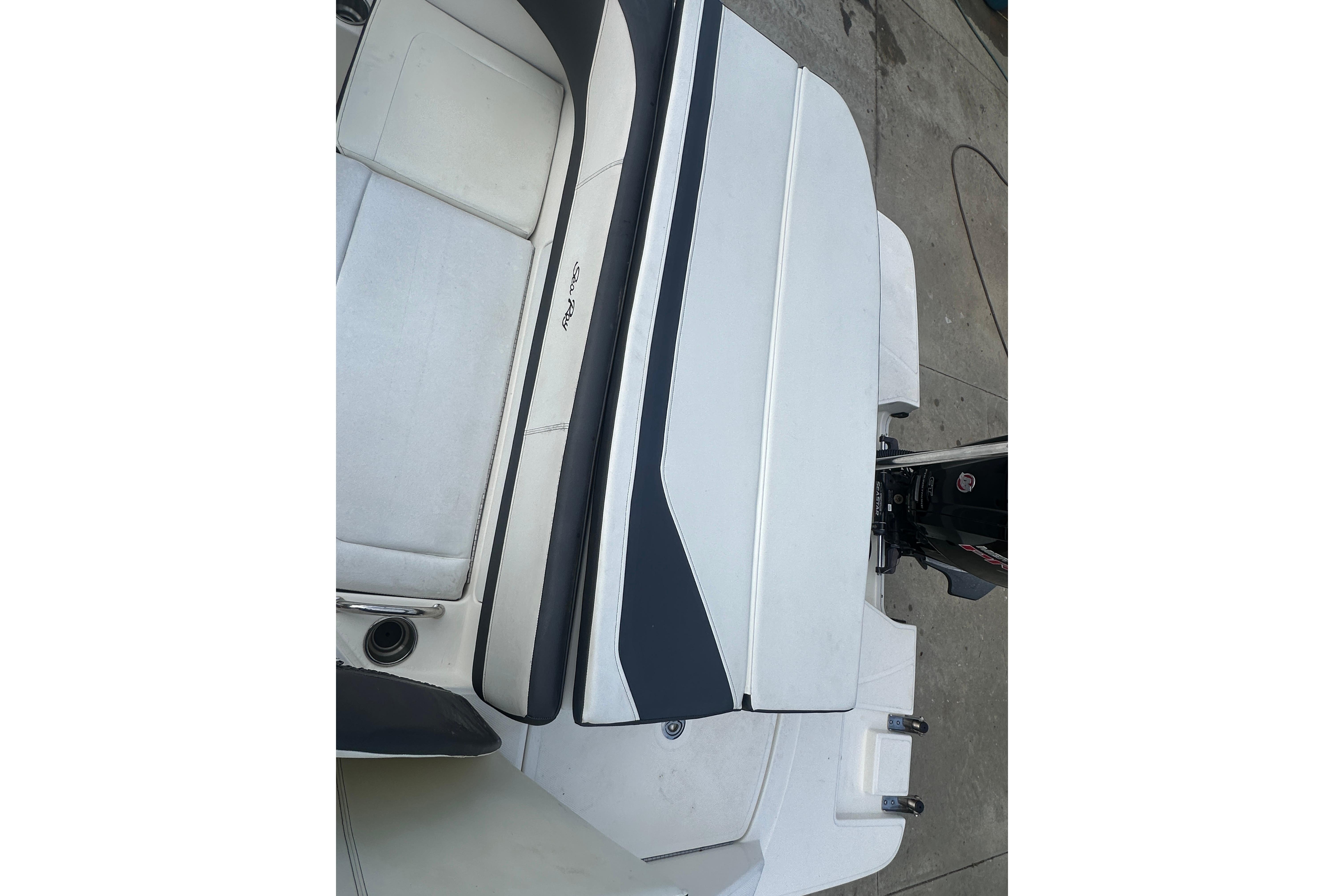 2017 Sea Ray SPX 190 Outboard boat interior with seating and motor detail.