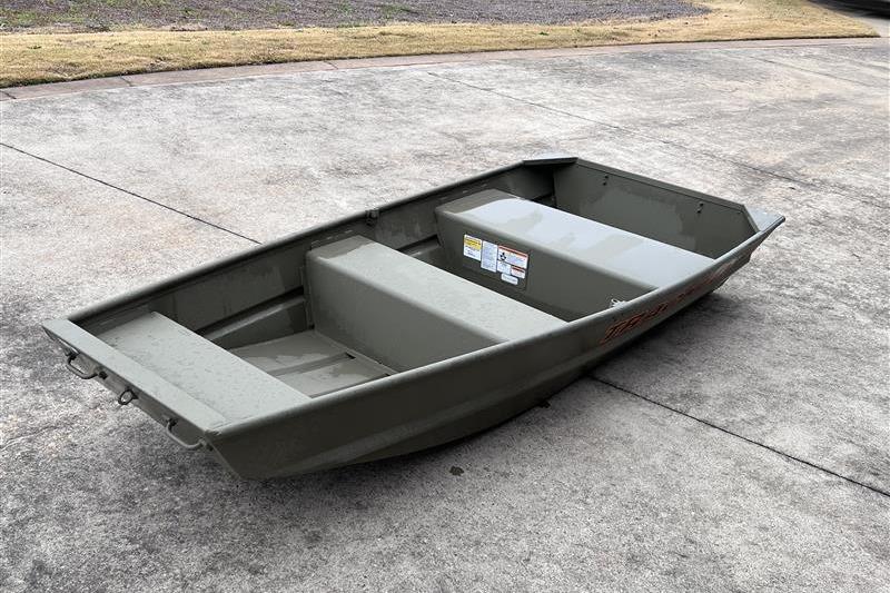 2026 Tracker Grizzly 10 Jon boat on concrete surface, showcasing its compact design.