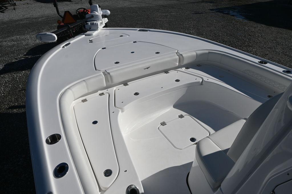 2026 Tidewater 2500 Carolina Bay boat deck with seating and storage compartments.