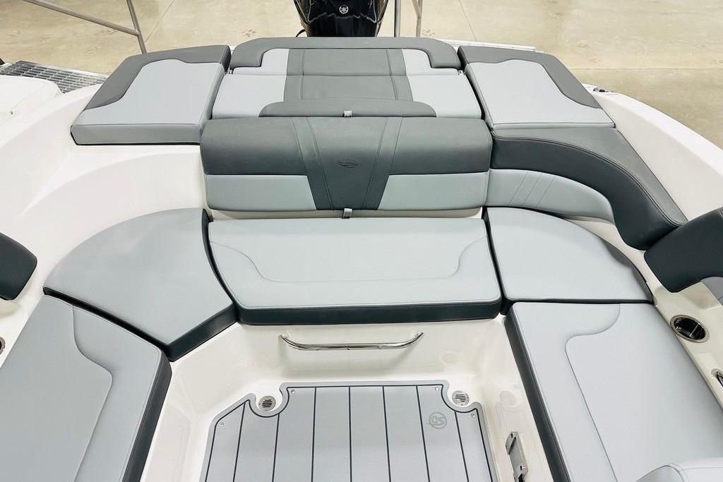 2025 Chaparral 23 SSi OB boat interior with gray cushioned seating.