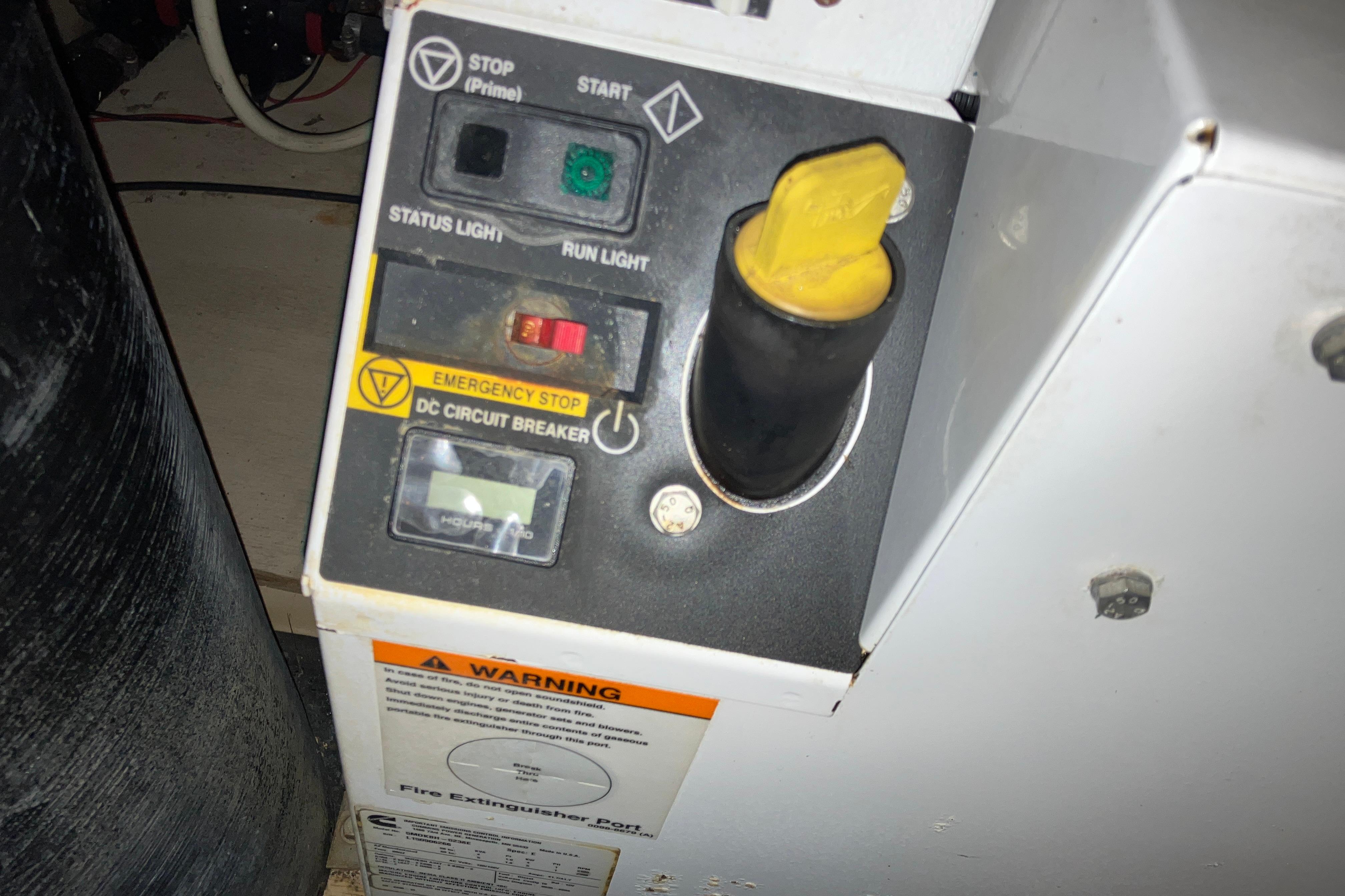 Control panel of a 2017 Cutwater C-30 Sedan with emergency stop and circuit breaker.