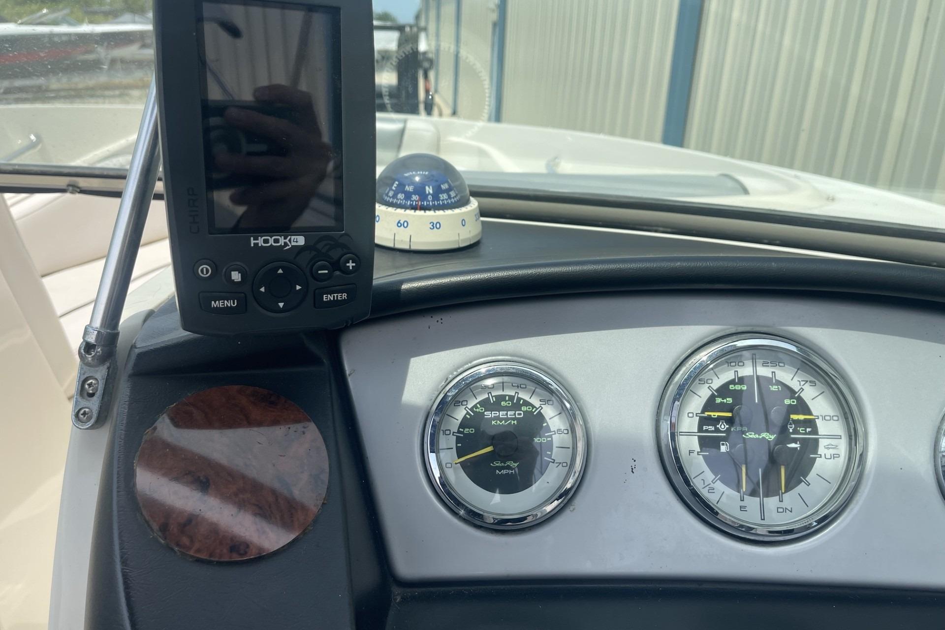 Dashboard of a 2010 Sea Ray 230 Bow Rider Select with gauges and navigation equipment.