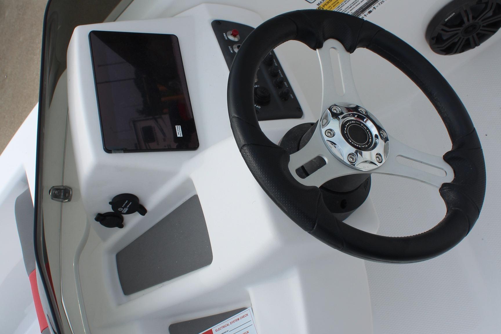 Steering console of 2026 Tahoe T16 boat with modern controls and tablet holder.