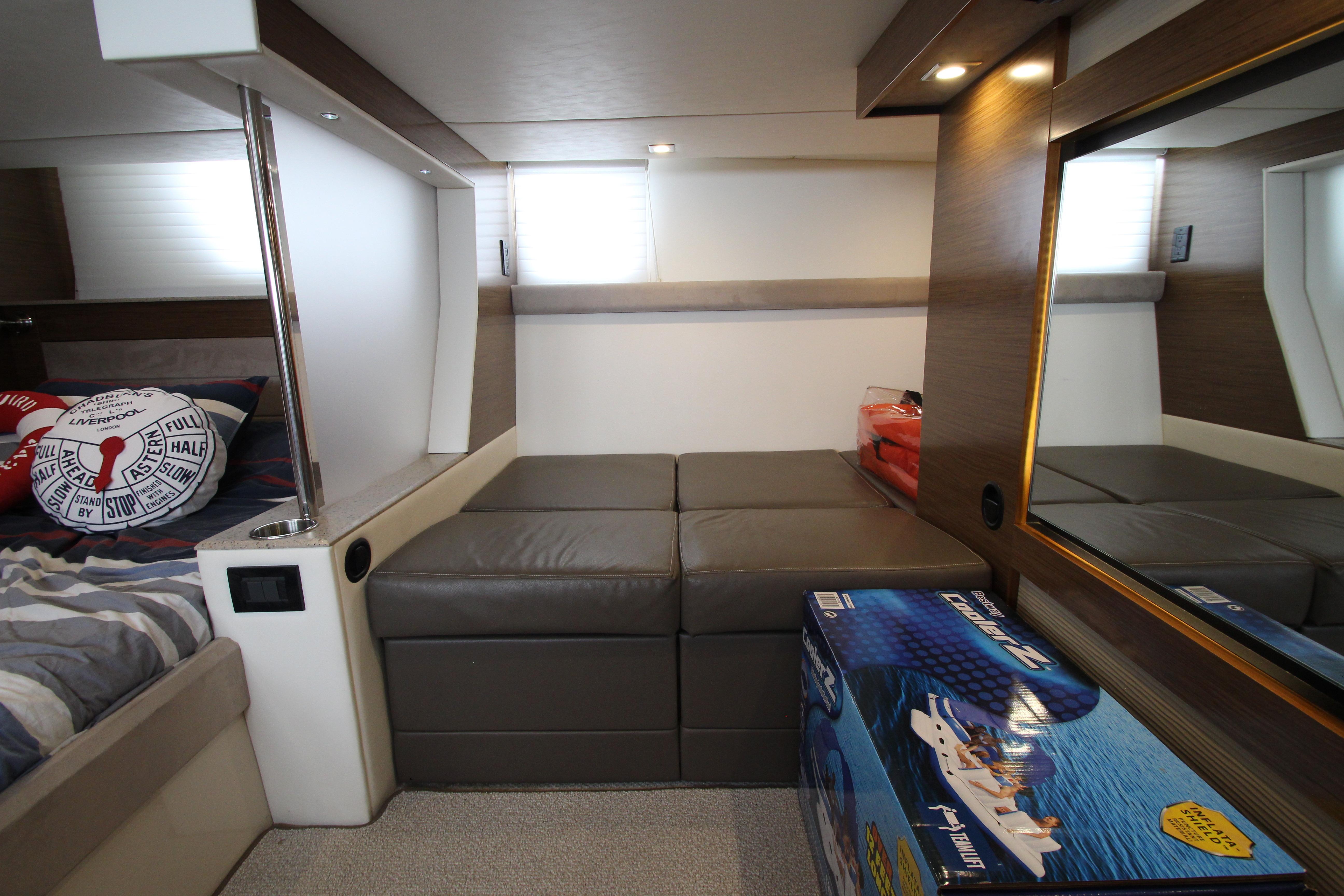 Interior of 2014 Cruisers Yachts 45 Cantius, featuring modern seating and decor.
