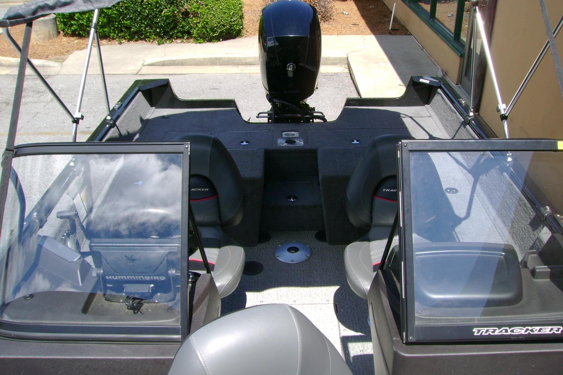 2023 Tracker Pro Guide V-175 WT boat interior with seating and motor, viewed from above.