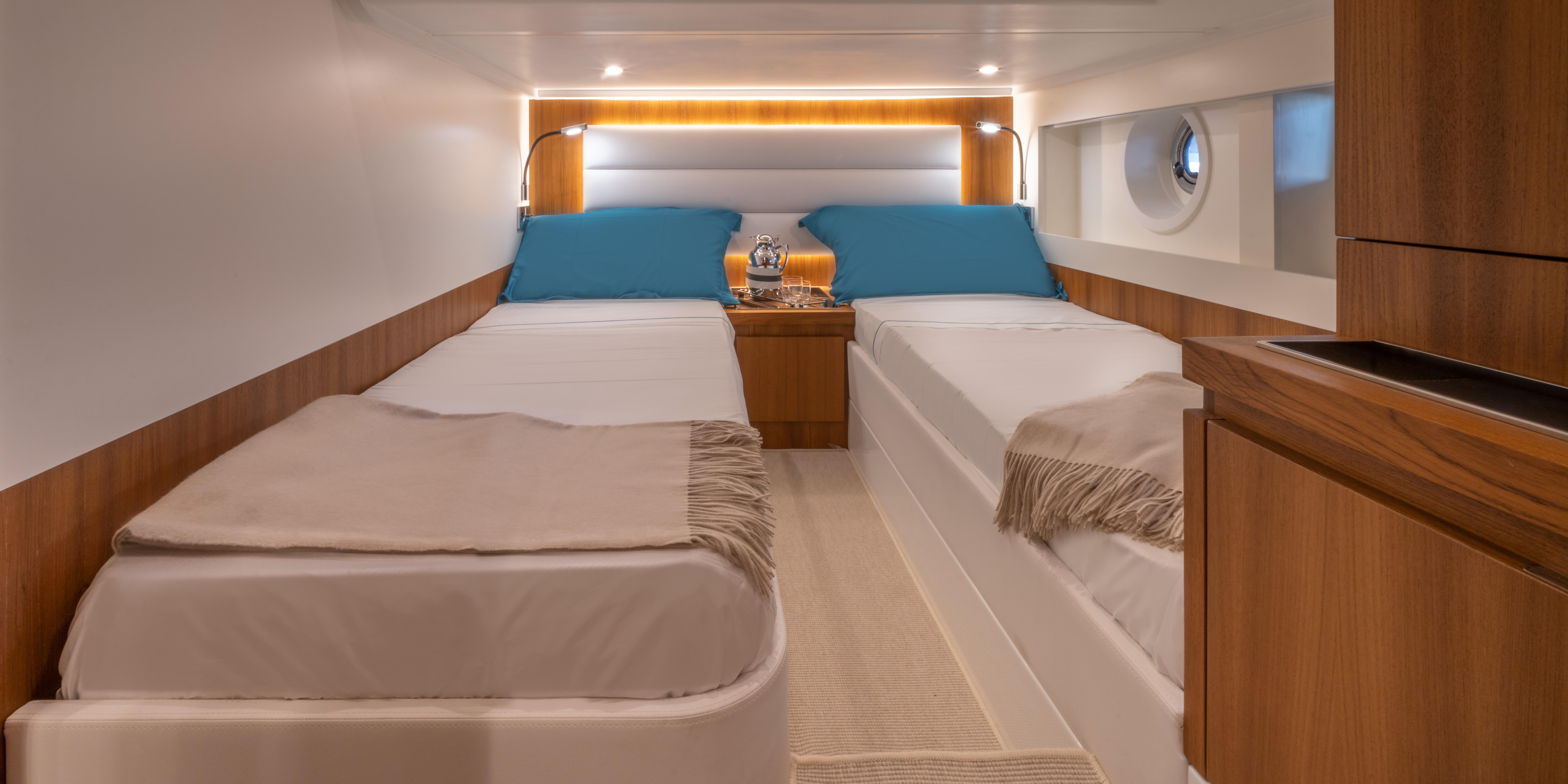 Interior cabin of 2024 Solaris Power 48 Lobster yacht with twin beds.