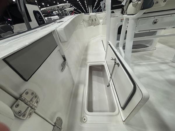 2025 Sea Pro 262 Offshore boat interior with open storage compartment.