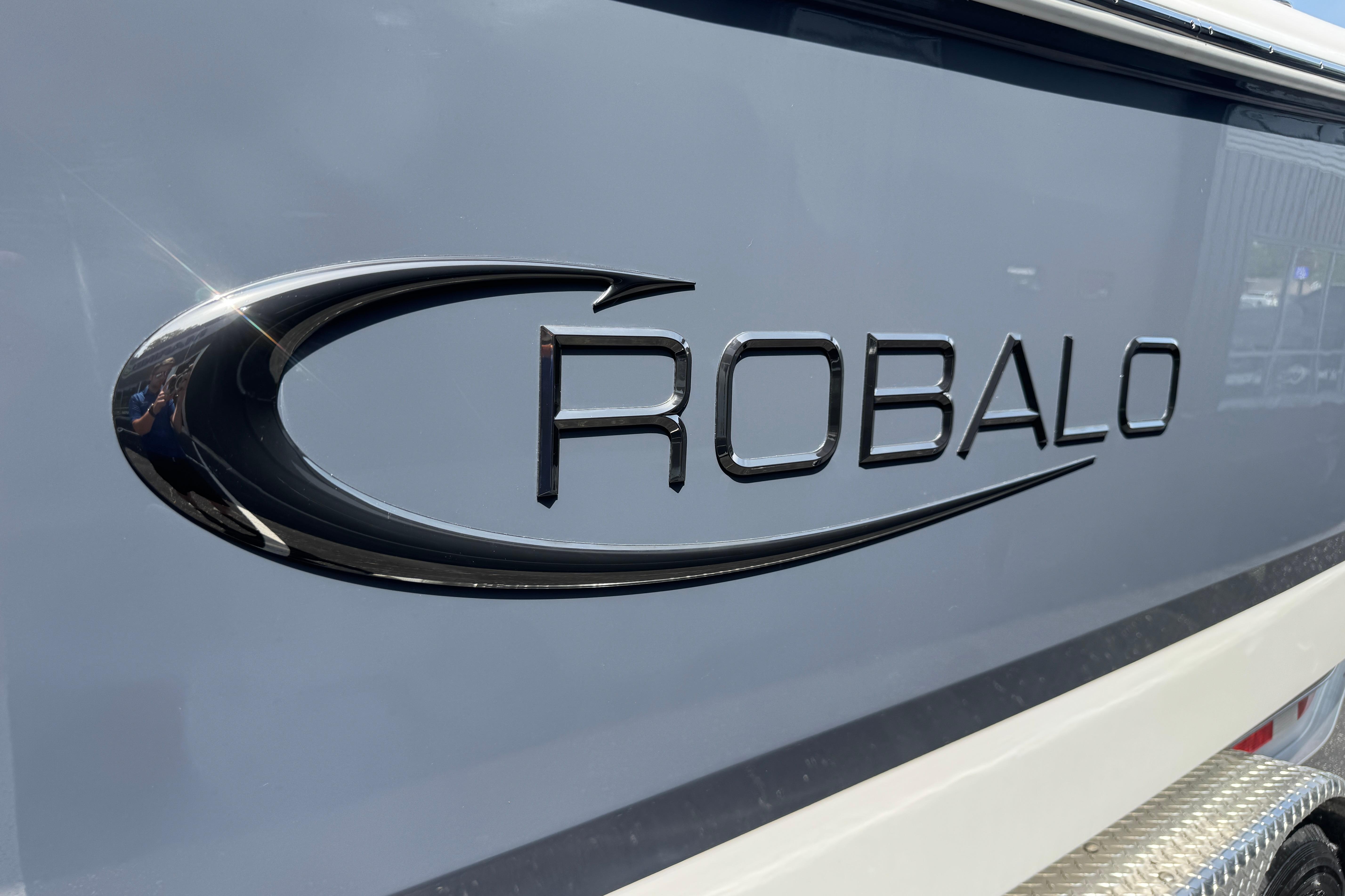 2026 Robalo R250 Center Console boat logo on sleek hull design.