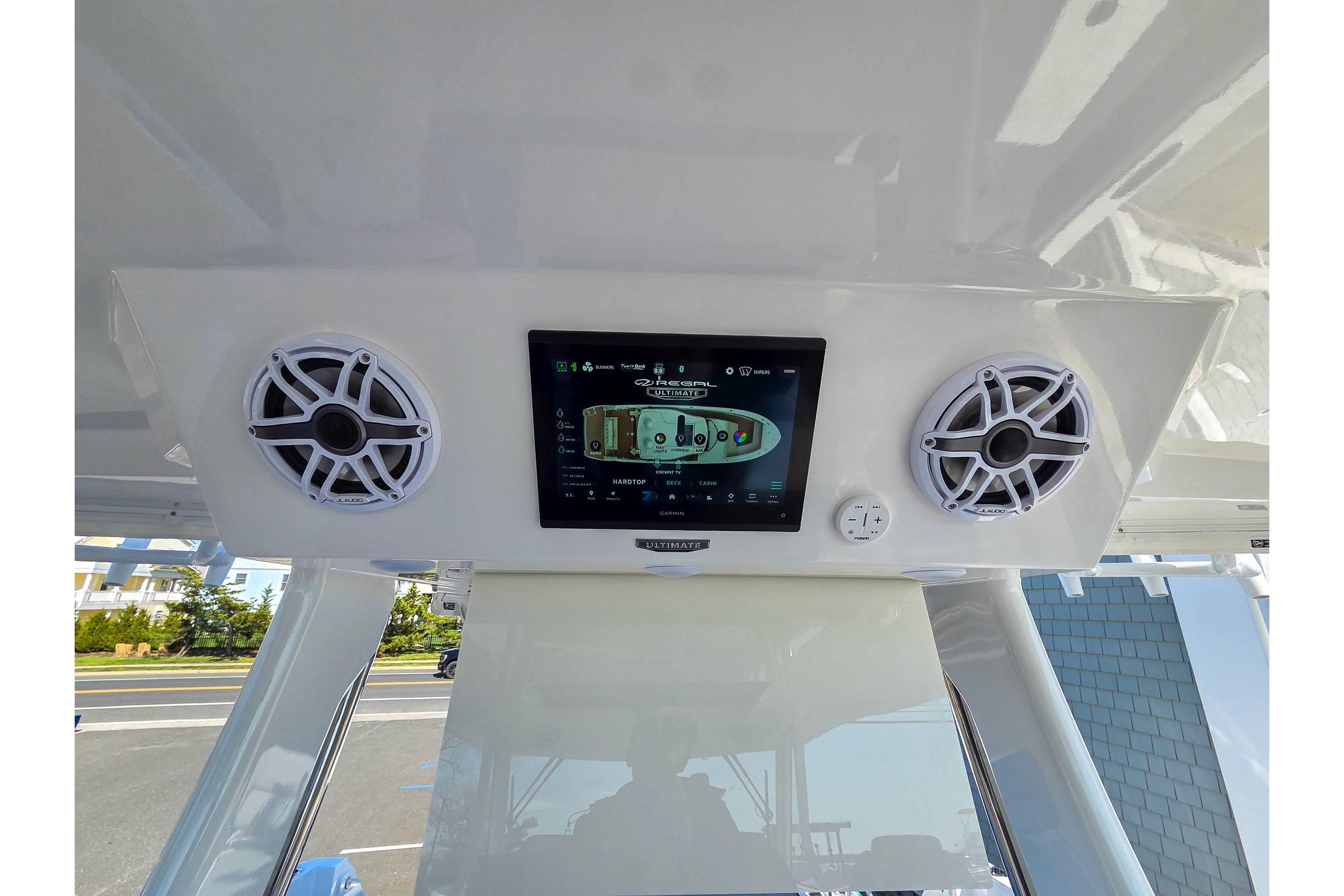 2026 Regal 38 SAV boat dashboard with speakers and touchscreen display.