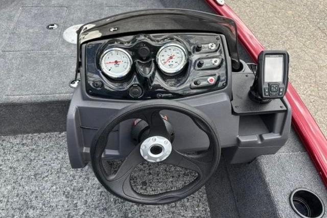 2025 Tracker Super Guide V-16 SC boat dashboard with steering wheel and gauges.