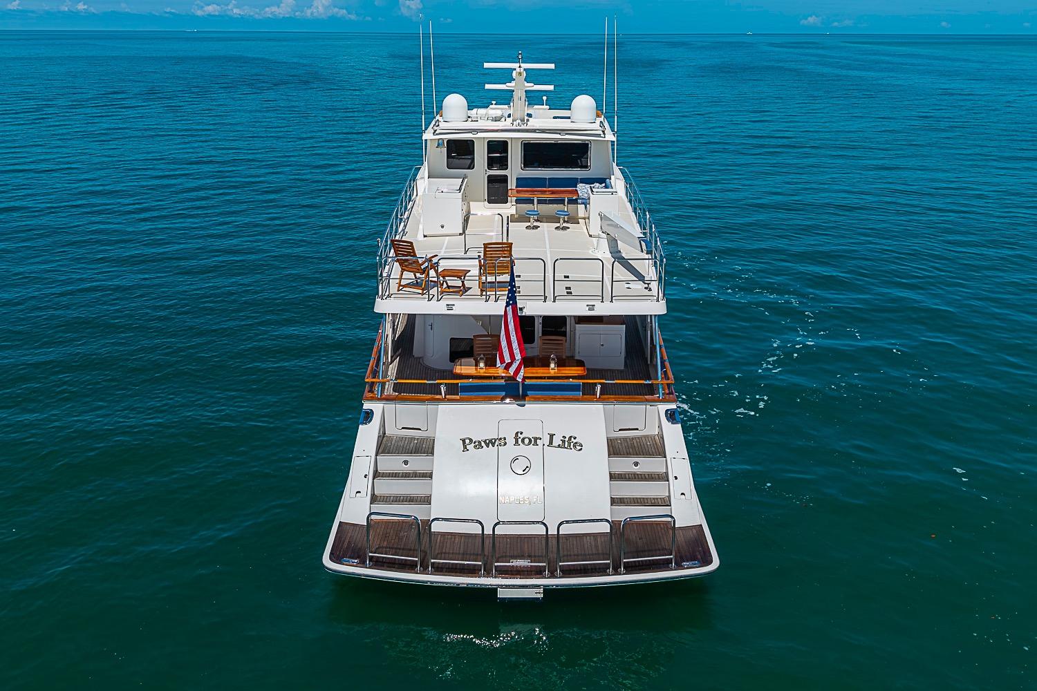 2014 Marlow 80 Explorer yacht "Paws for Life" cruising on open sea.