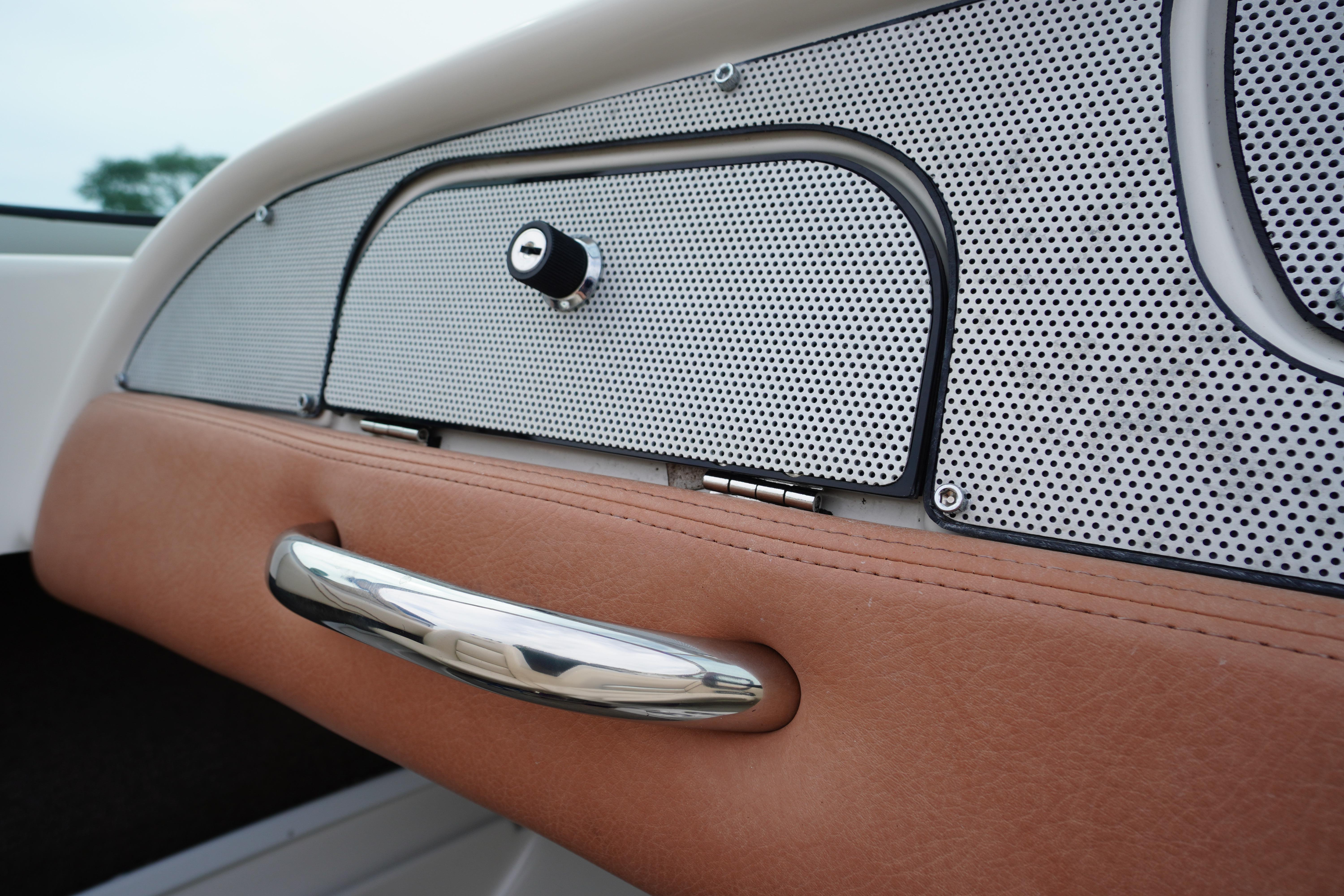 2005 Chris Craft Speedster Heritage dashboard with perforated metal and leather accents.