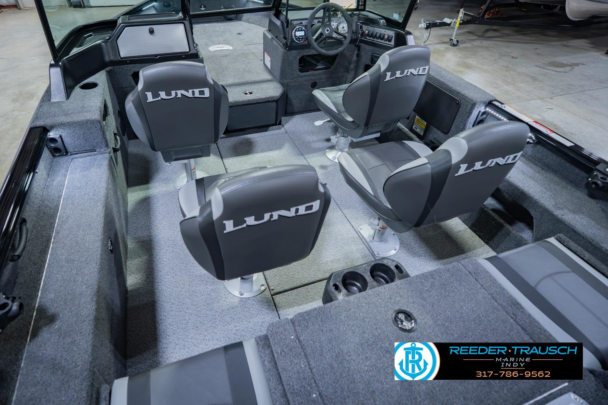 2026 Lund 1775 Impact XS boat interior with four seats and steering console.