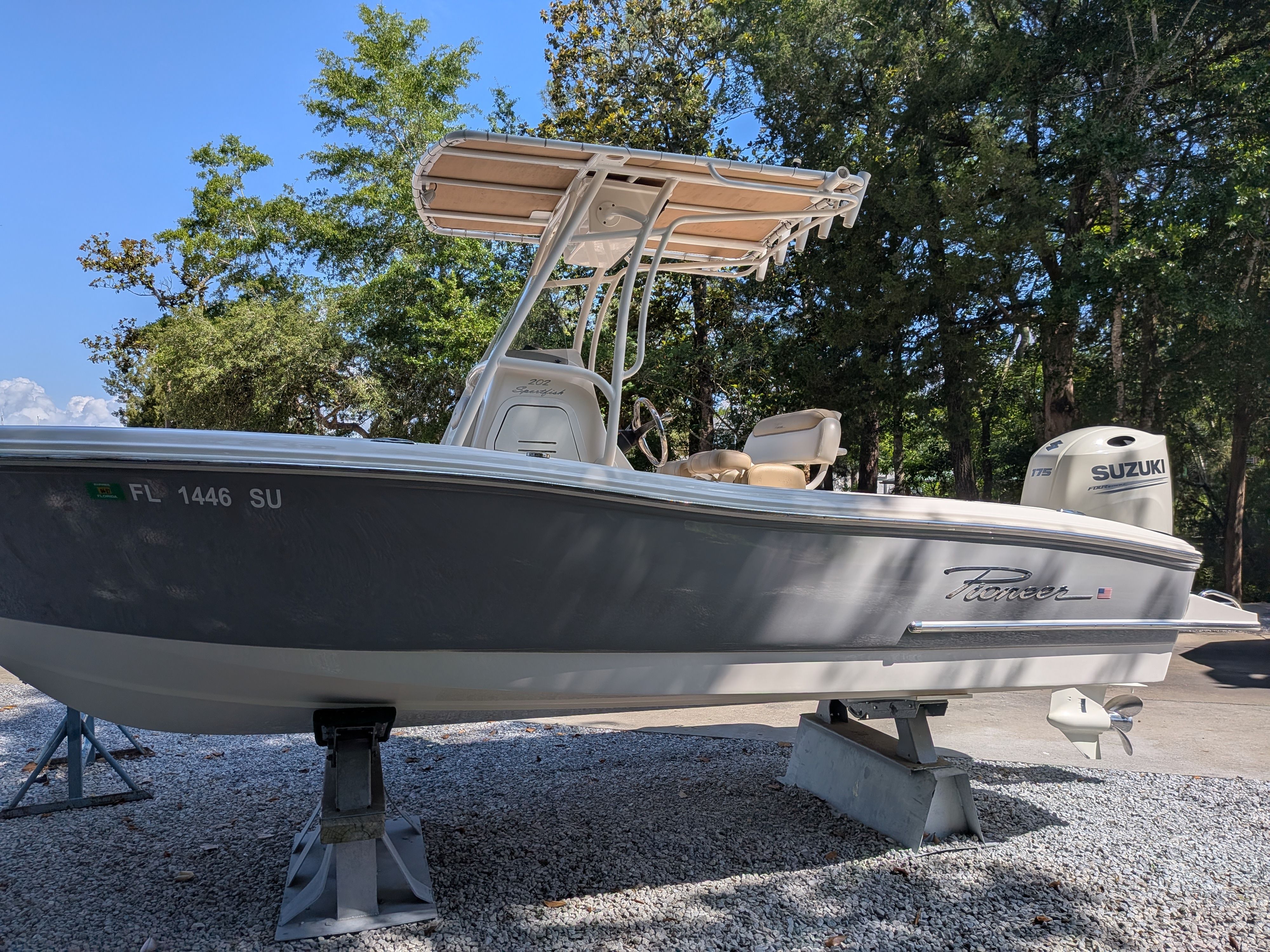 2020 Pioneer 202 Sportfish boat on stands outdoors.