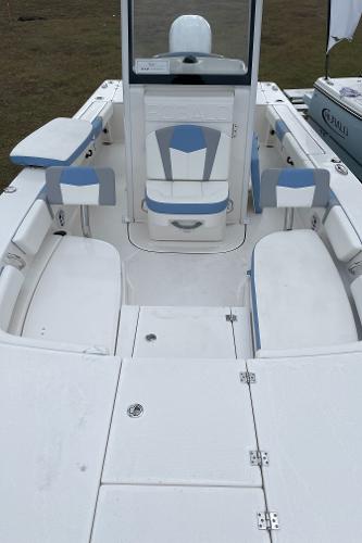 2026 Robalo 246 Cayman boat interior with white and blue seating, spacious deck layout.