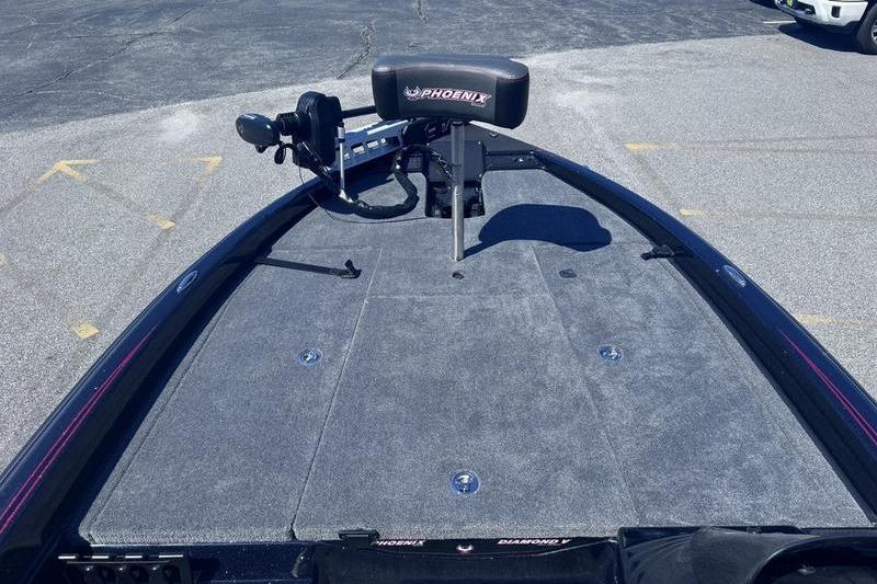 2026 Phoenix 819 ZXL boat deck with seating and equipment, parked on asphalt.