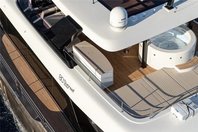 2026 Sunreef 80 Power yacht deck with jacuzzi and seating area.