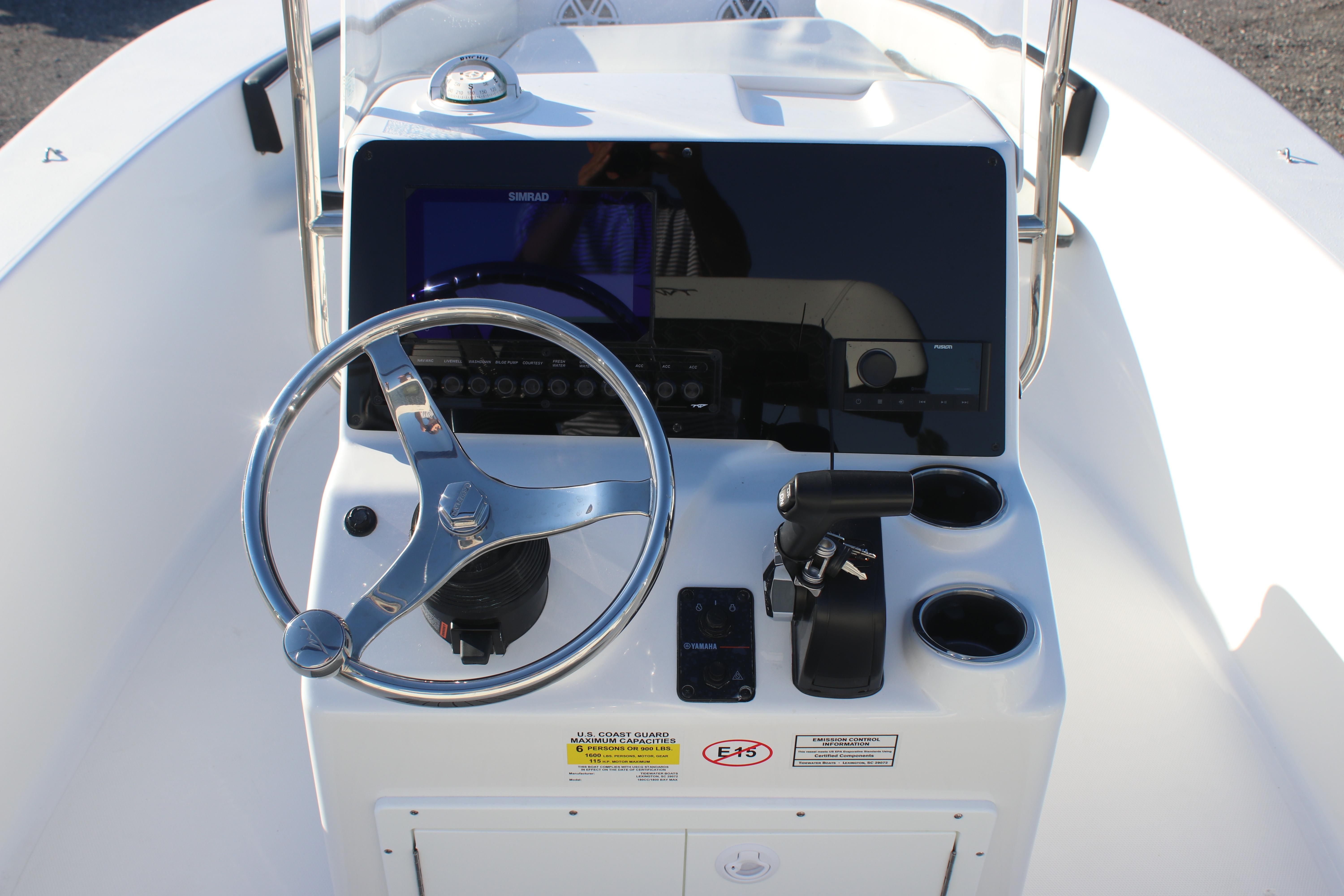 2026 Tidewater 180 CC Adventure boat console with steering wheel and controls.
