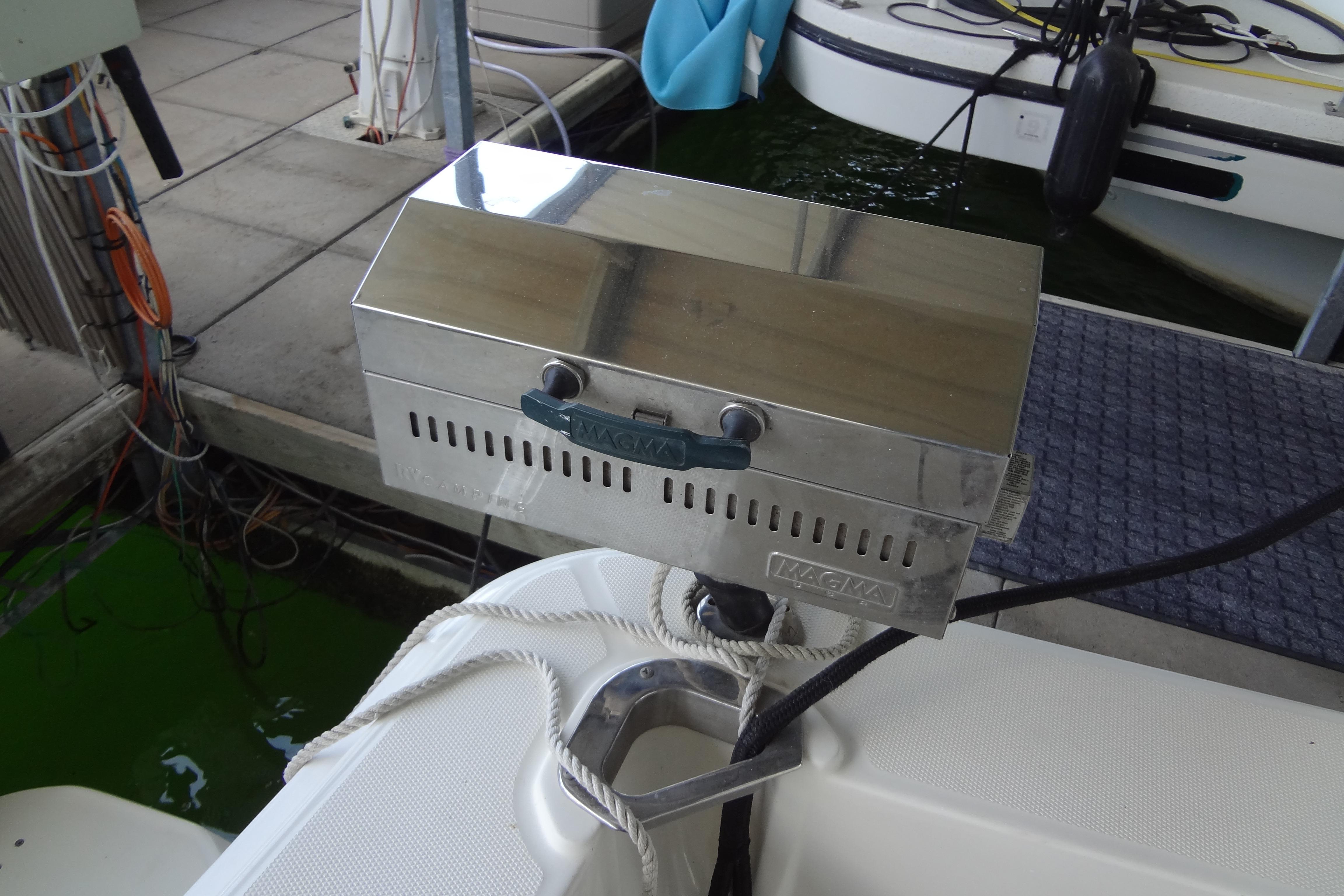 Stainless steel grill mounted on a 2005 Silverton 34 Convertible boat.