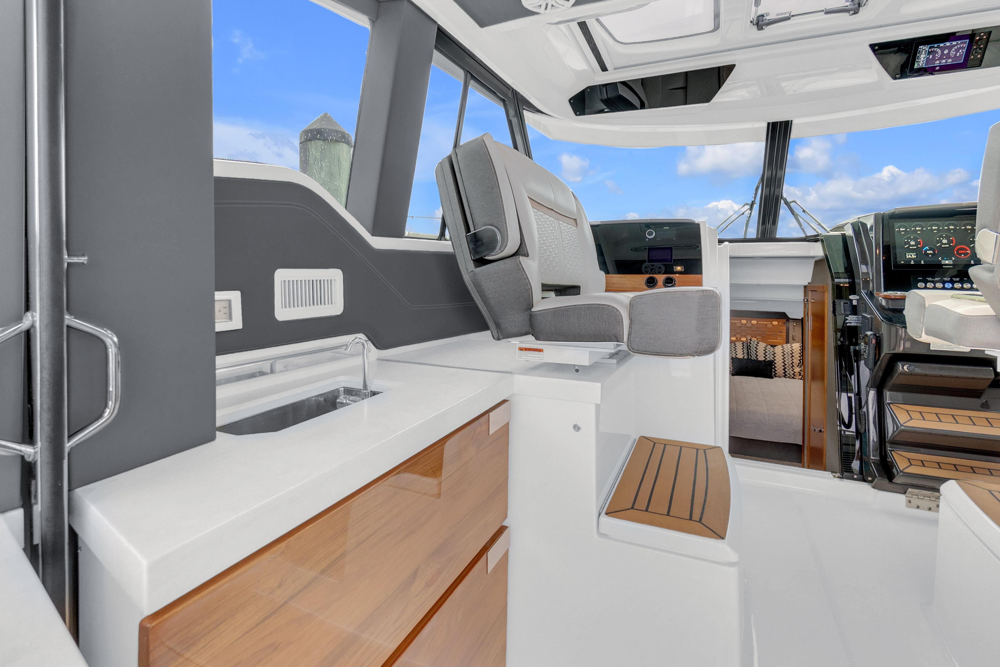 Interior of 2021 Tiara Sport 43 LE yacht with modern helm and seating.