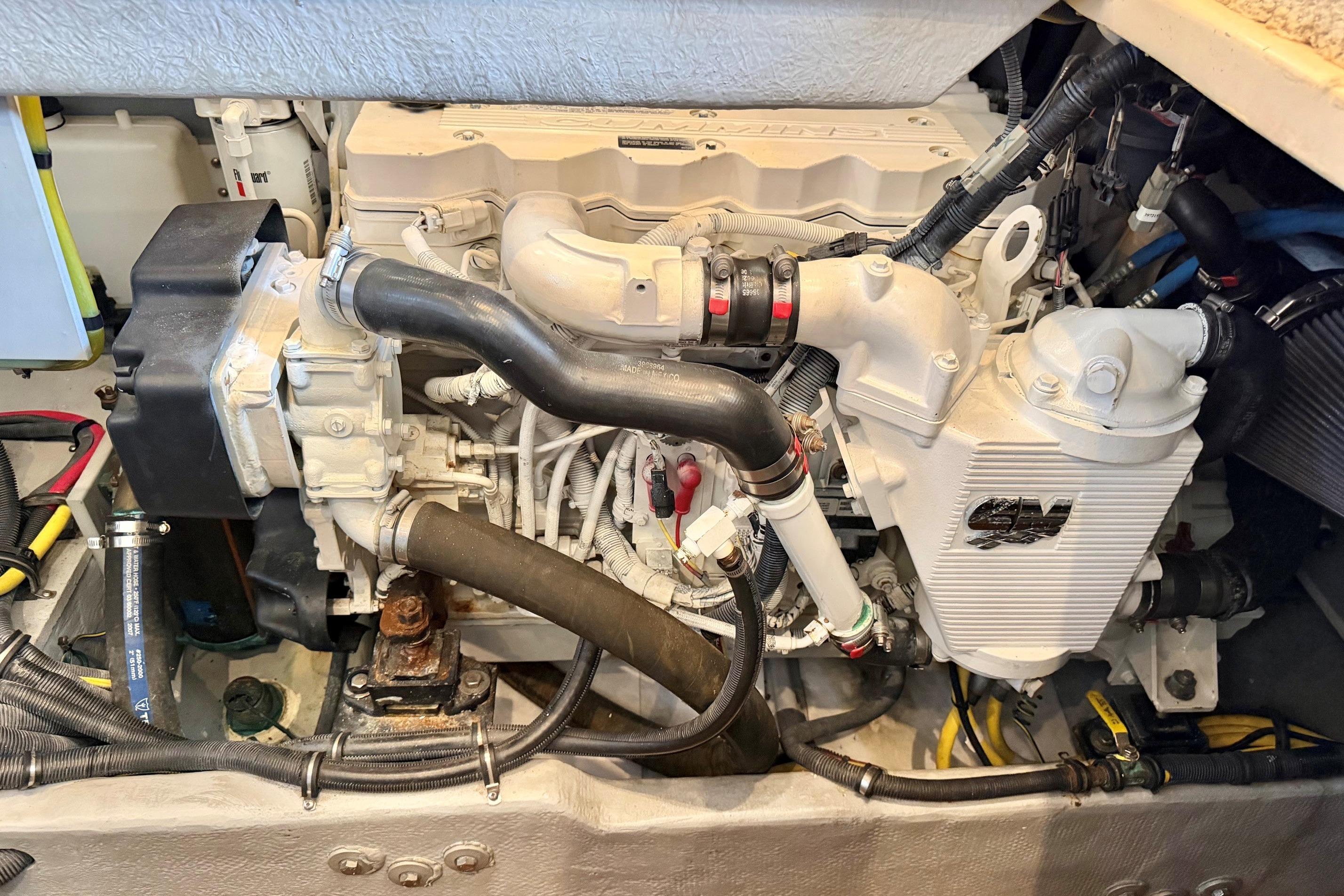 Engine compartment of a 2007 Meridian 391 Sedan boat, showcasing detailed mechanical components.