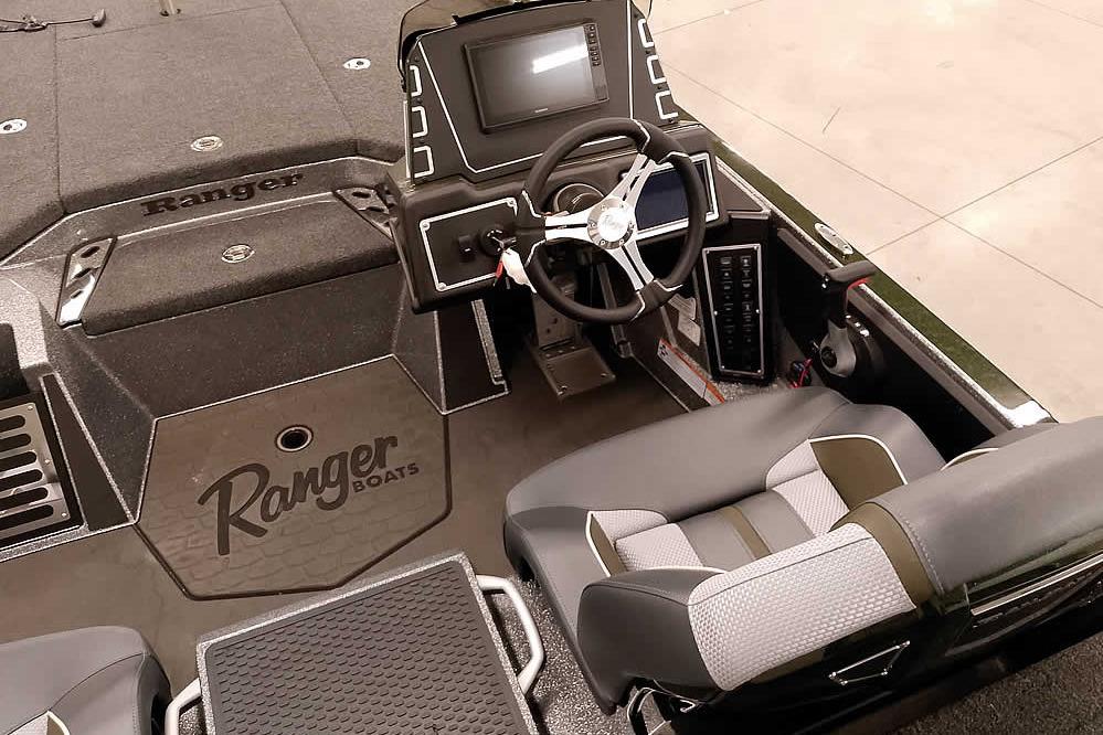 2026 Ranger Z519R Cup-Equipped boat interior with steering wheel and seating.