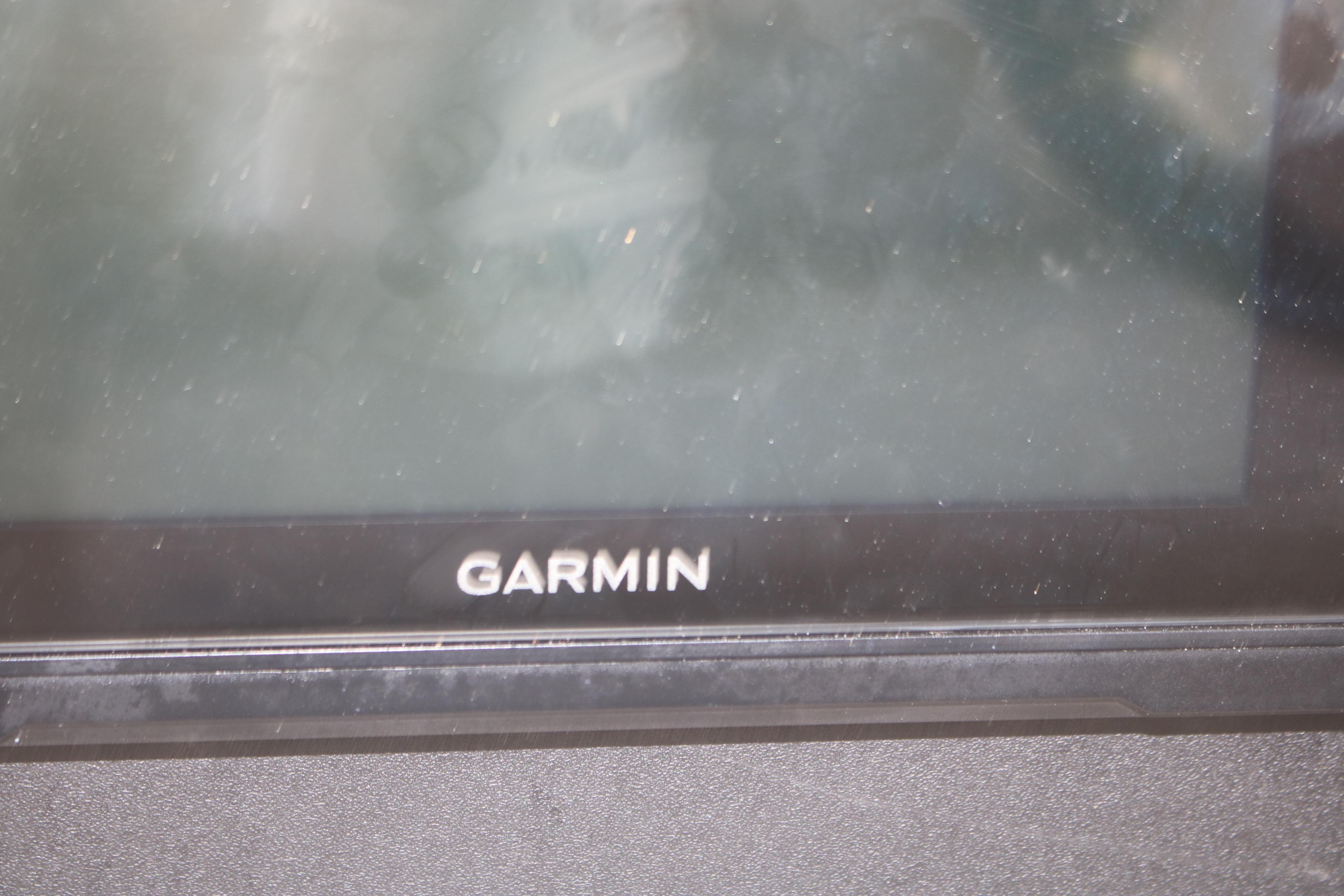 Garmin display screen on 2011 Larson Carbiro 240 boat dashboard.