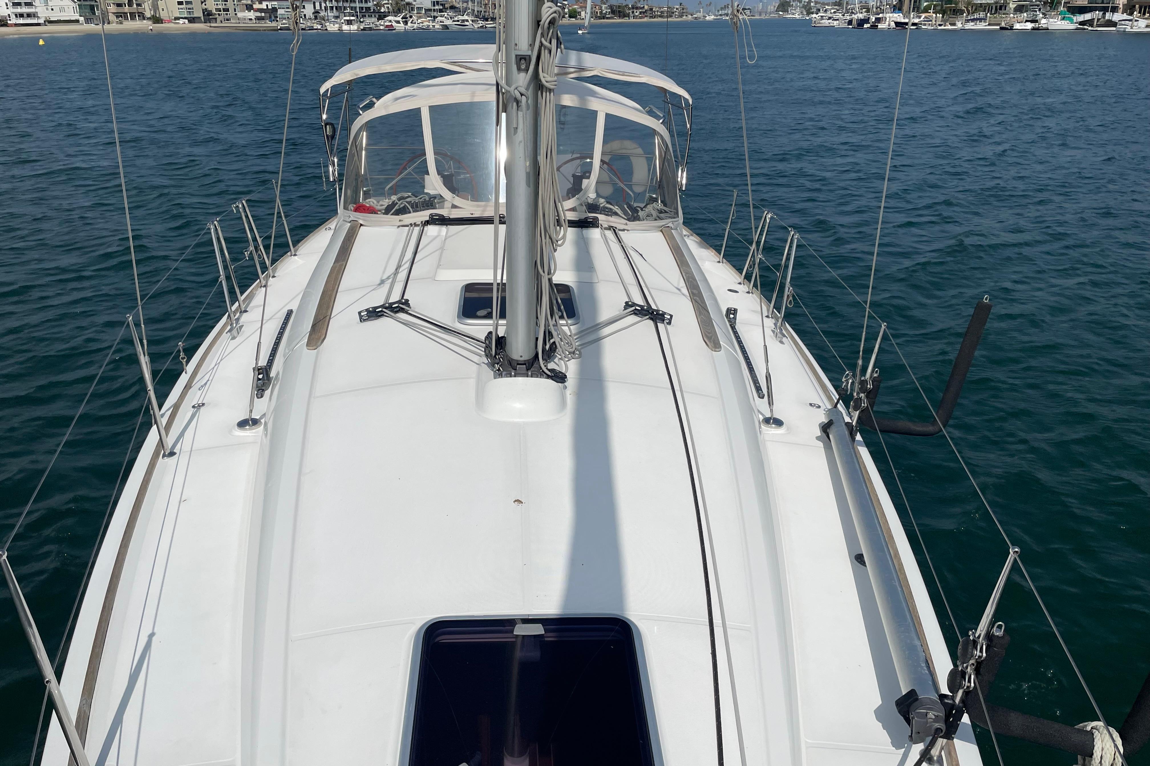 2007 Jeanneau Sun Odyssey 39 DS sailboat on calm water, viewed from deck.