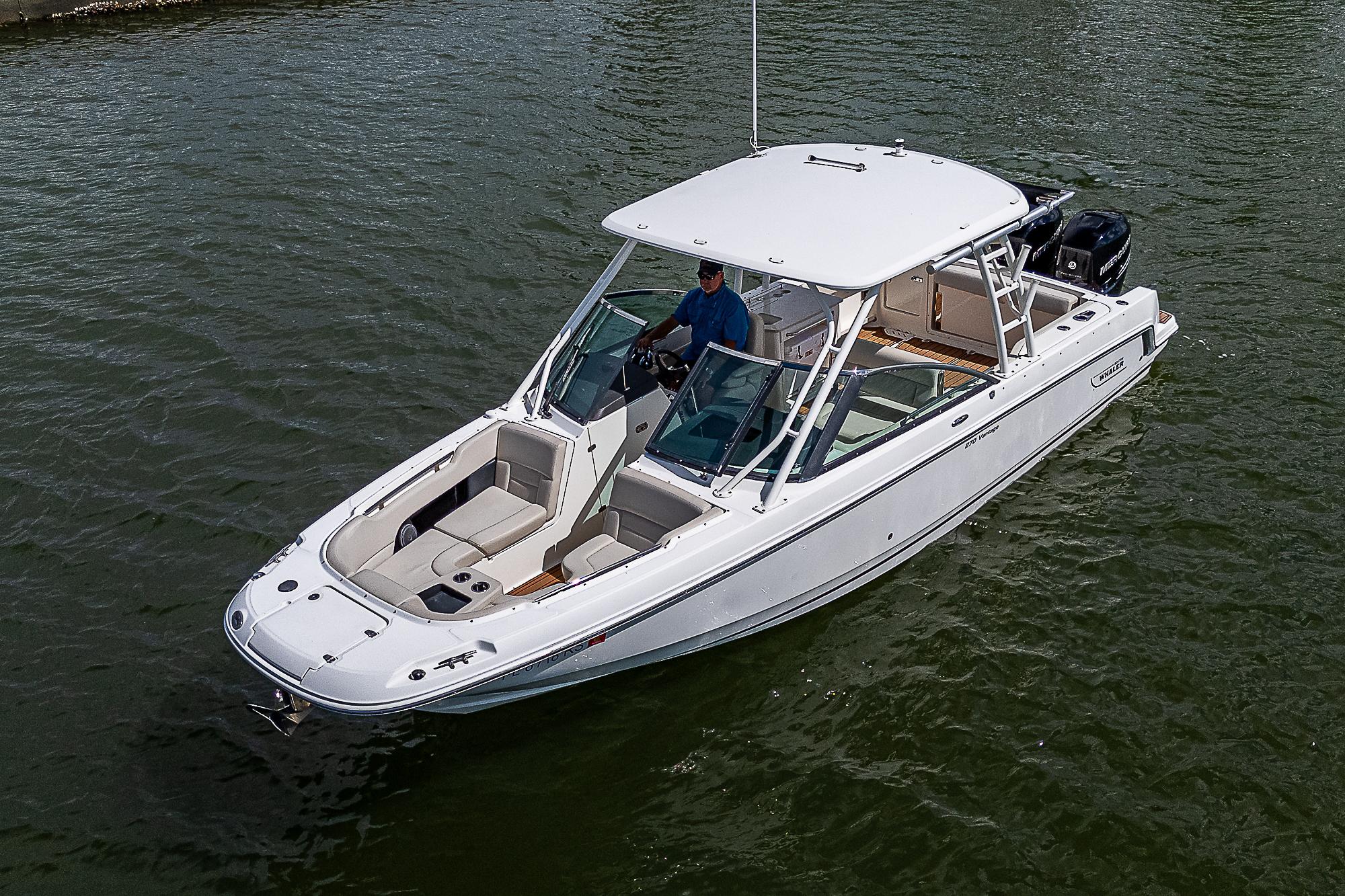 2018 Boston Whaler 270 Vantage boat on water, featuring sleek design and spacious seating.