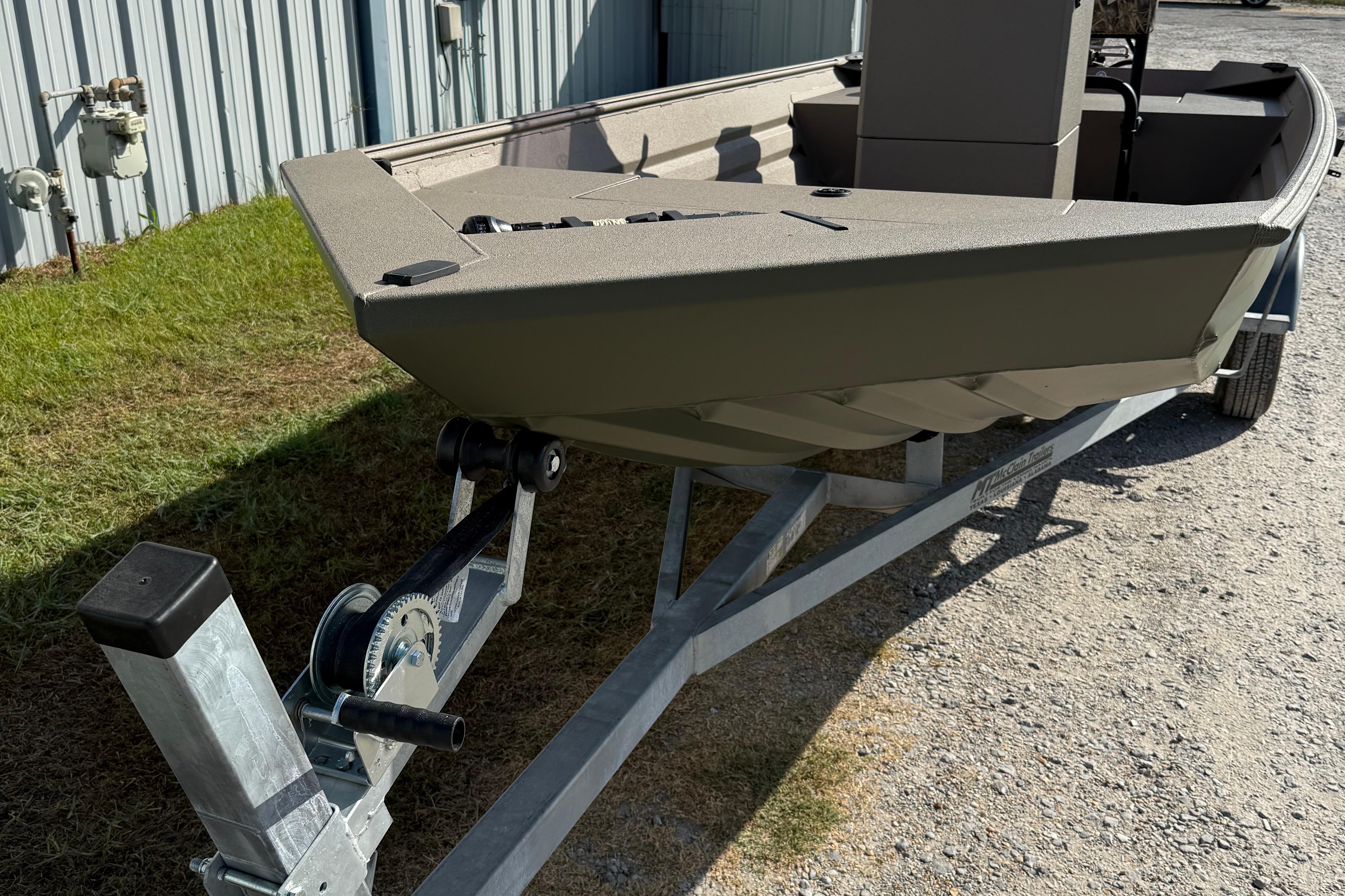 2025 Alweld 1756 V MARSH C.C. boat on trailer, parked outdoors.