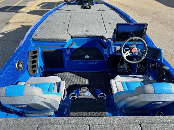 2024 iKon LX 20 boat interior with blue and gray seats, steering wheel, and dashboard.