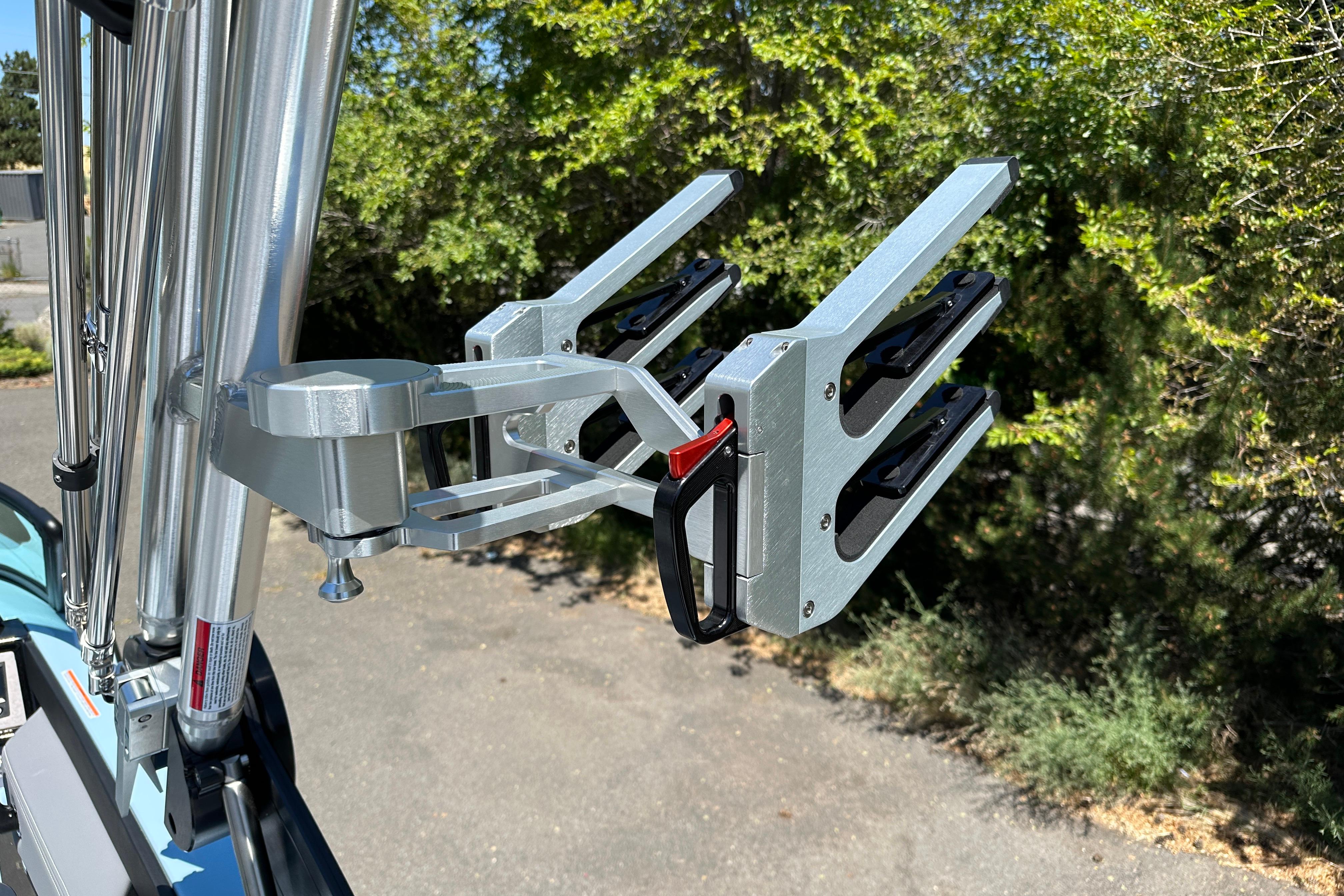 2023 MasterCraft NXT23 wakeboard rack with metallic finish, mounted on a boat.