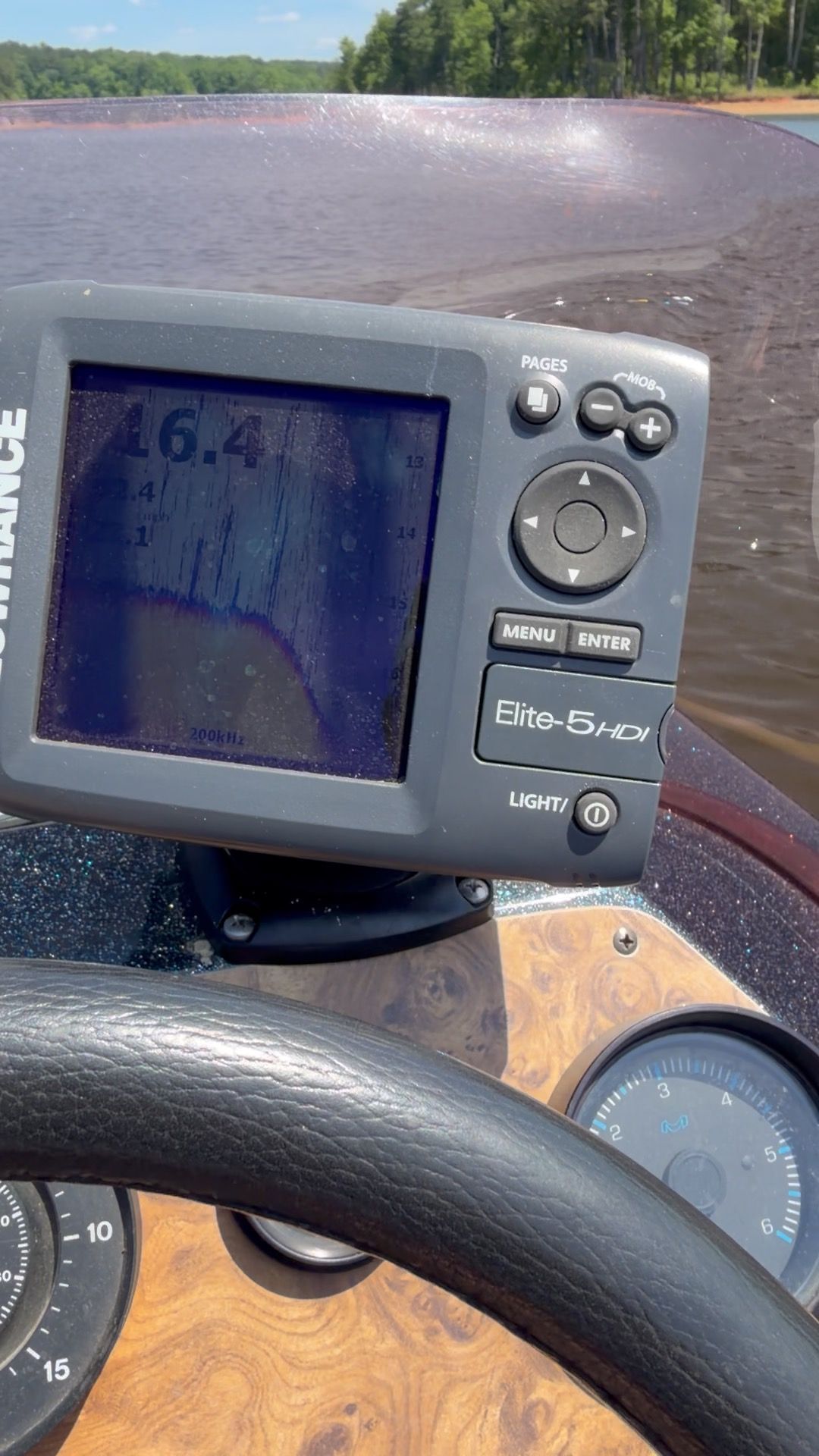Ranger 365V boat with fish finder on a lake, 1990 model.