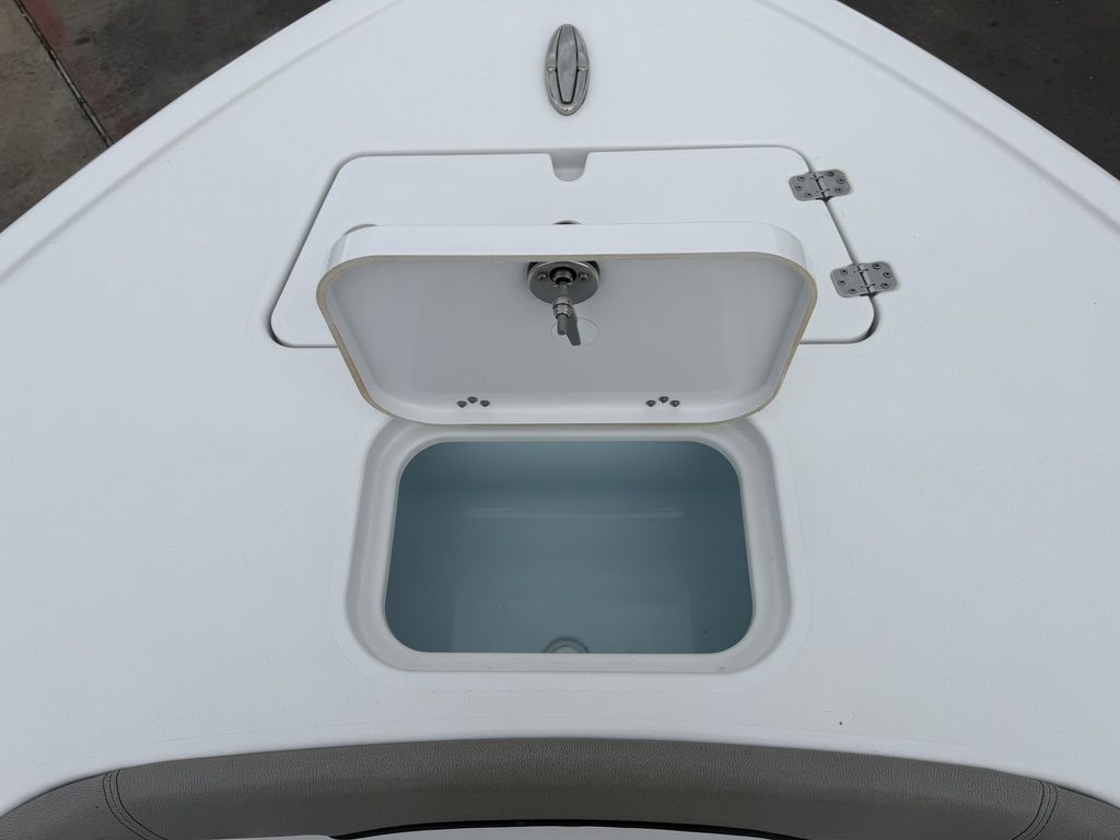 The image shows an open storage compartment on a 2025 Sportsman Masters 247OE Bay Boat.
