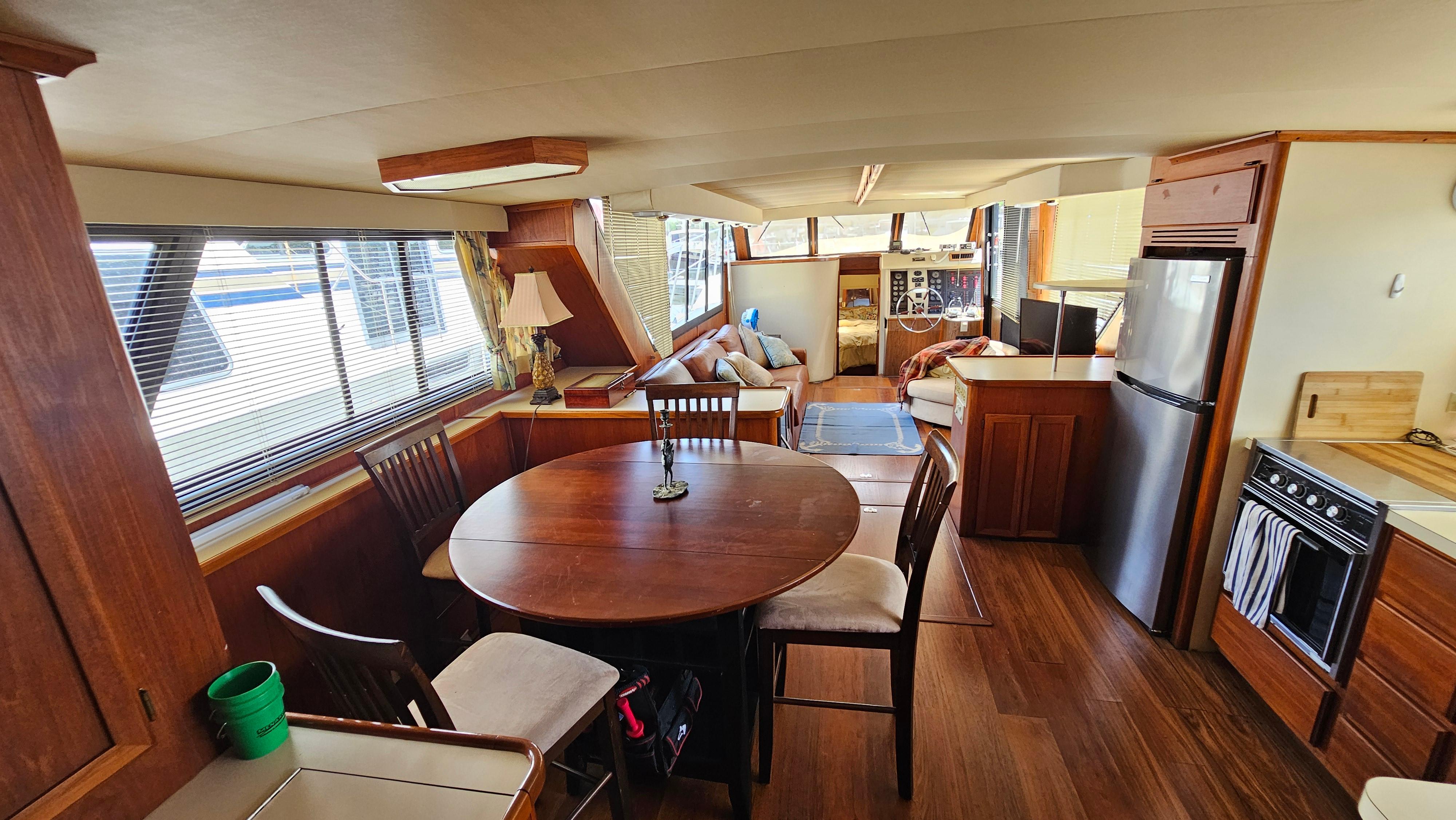 Interior of 1988 Bluewater Yachts 55 Coastal Cruiser with dining area and kitchen.