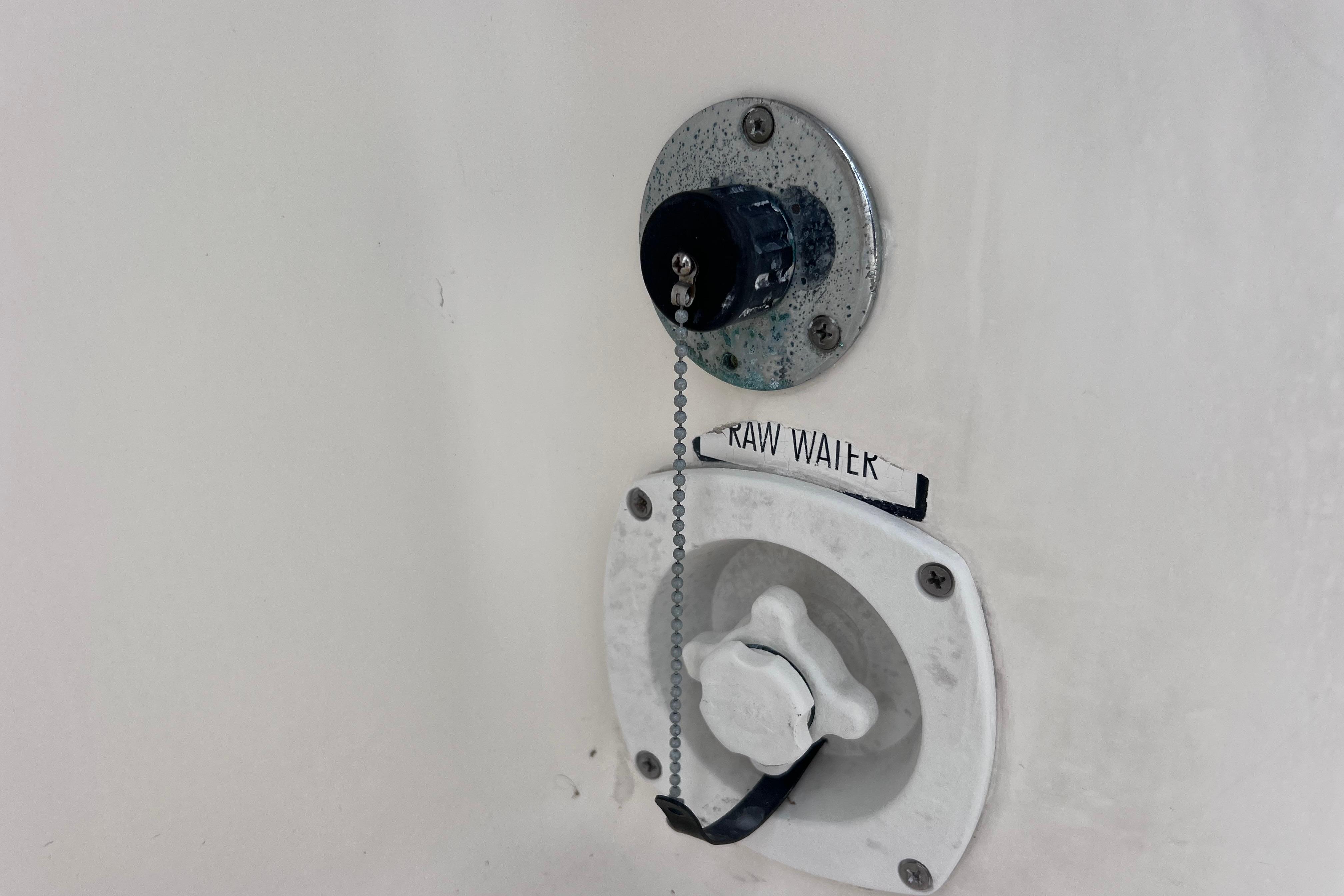 2005 Pursuit 3070 Offshore boat raw water intake valve and cap.