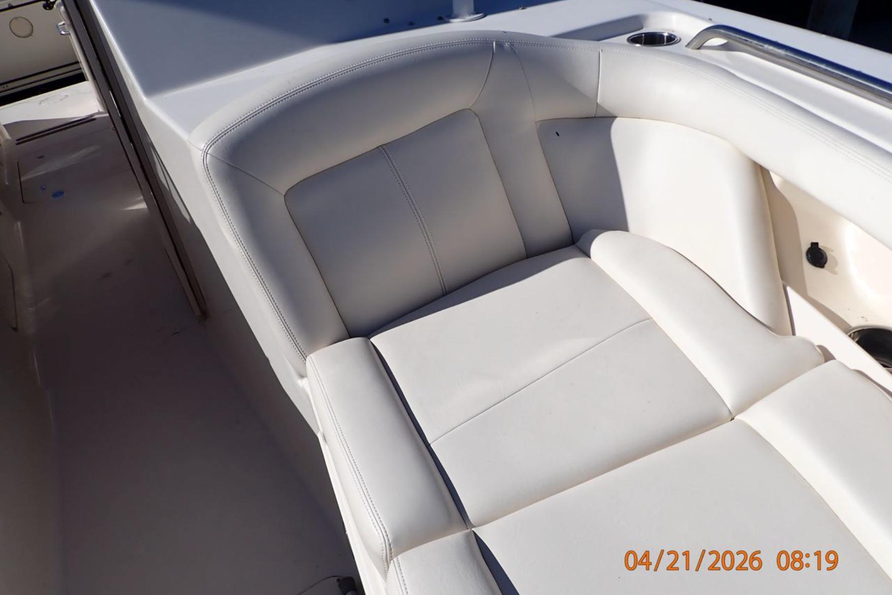 2016 Grady-White Freedom 335 boat interior with white cushioned seating.