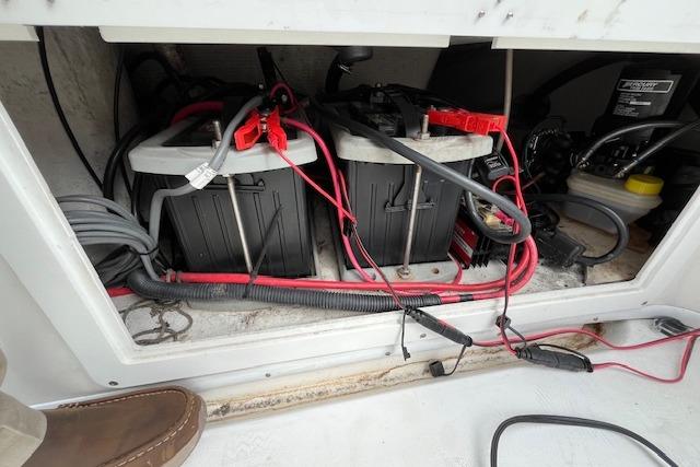 2001 Fountain 38 Center Console battery compartment with wiring and connections.