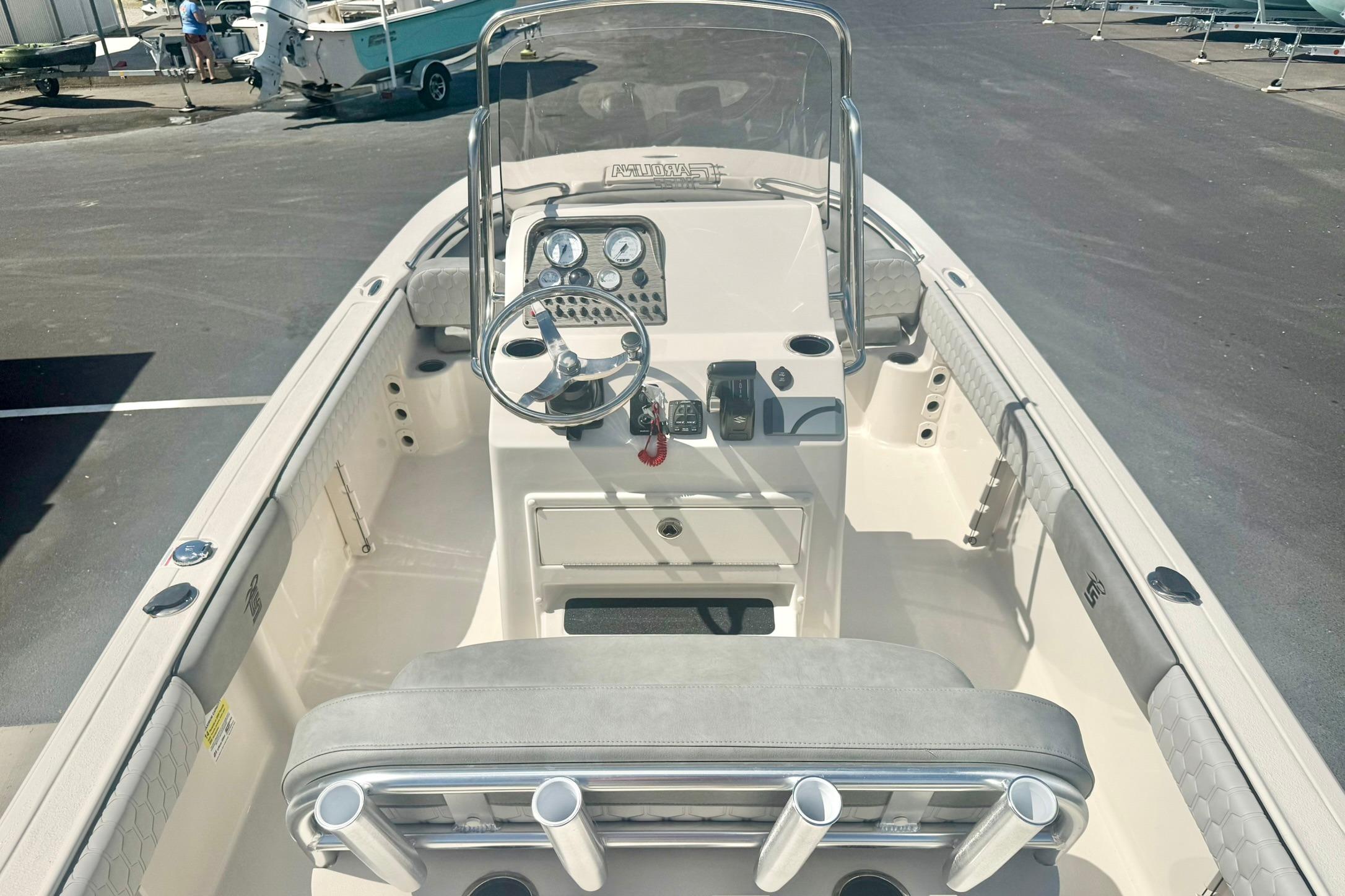 2026 Carolina Skiff 21 Ultra Elite boat interior with steering console and seating.