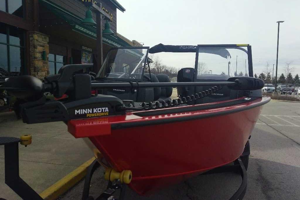 2026 Tracker Targa V-18 WT boat with Minn Kota PowerDrive motor, parked outdoors.