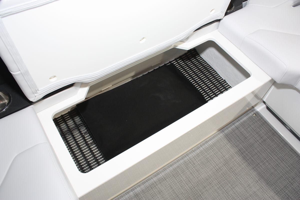 2023 Formula 380 Super Sport Crossover OB storage compartment with open lid, showcasing interior space.