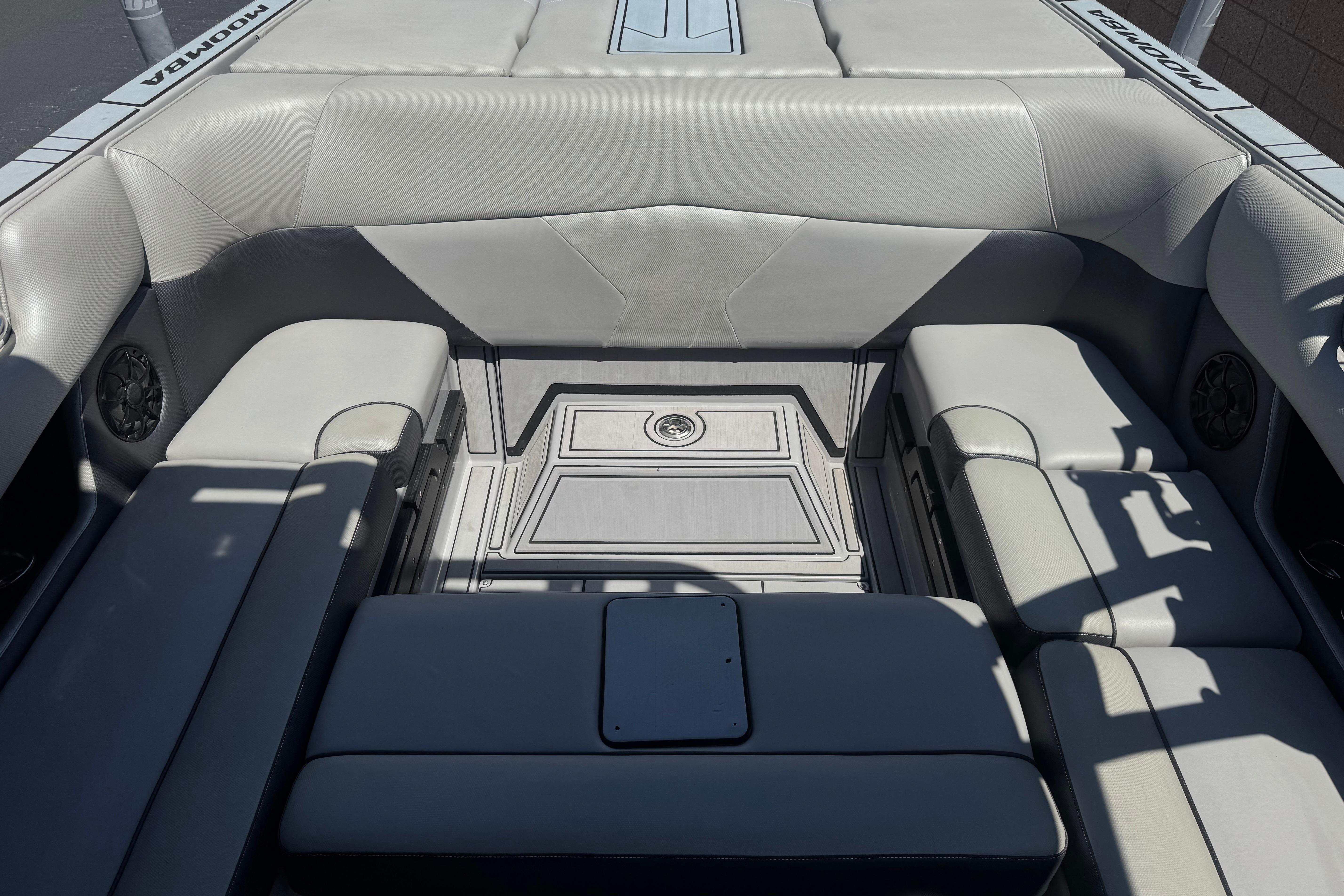 2022 Moomba Max boat interior with gray seating and speaker system.