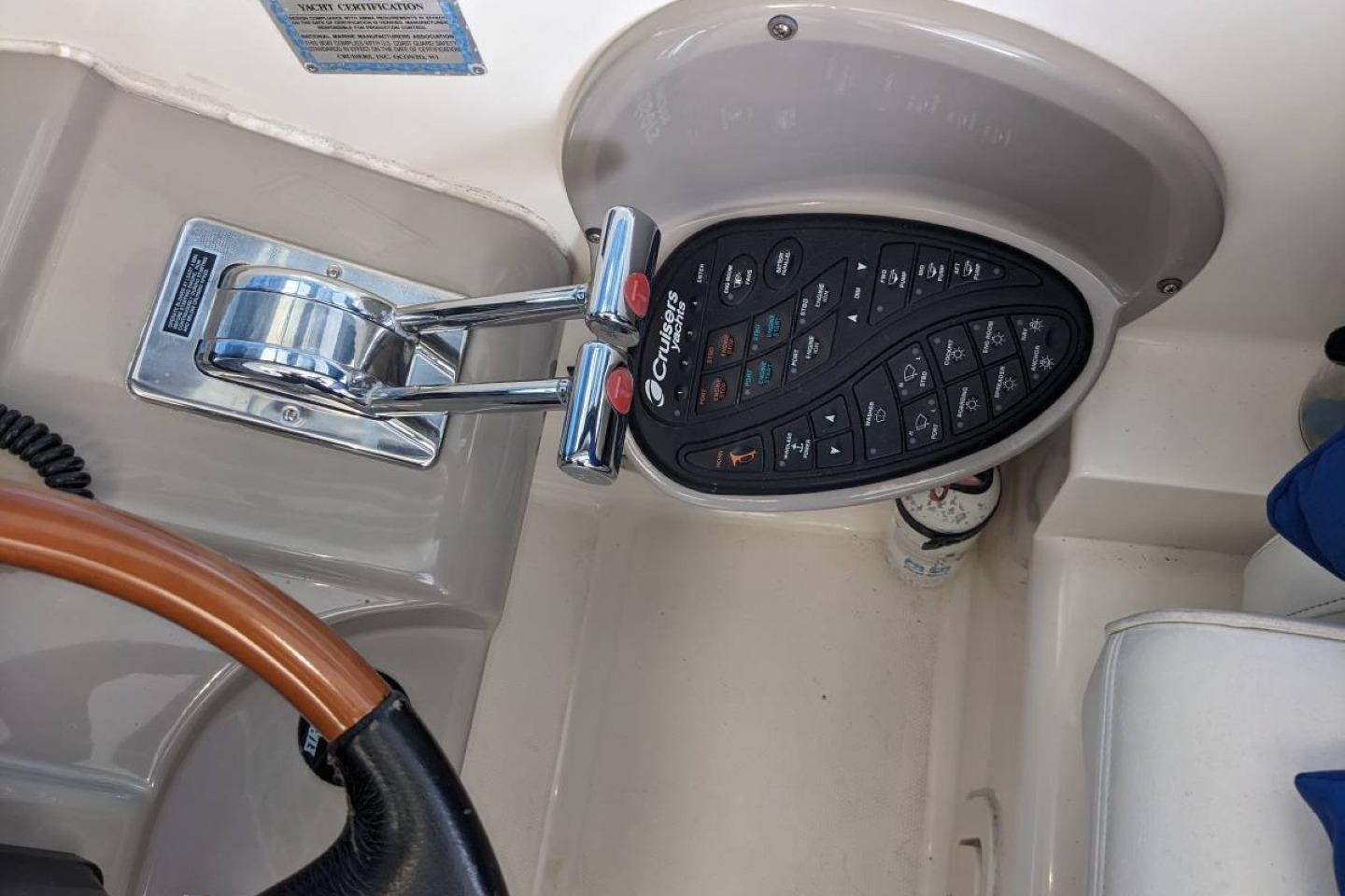 Control panel and throttle of a 2003 Cruisers 3970 yacht.