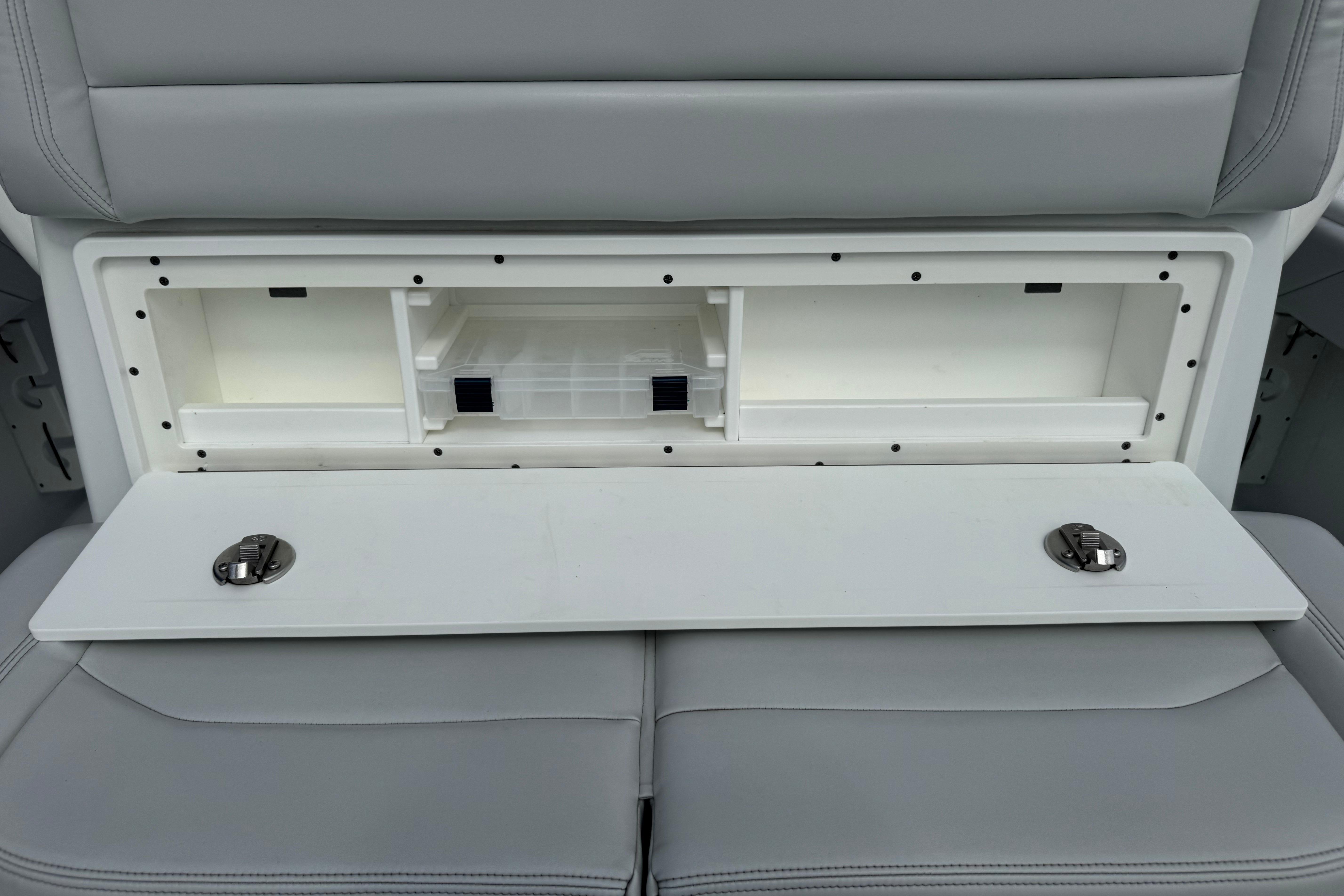 2022 Yellowfin 32 Offshore boat storage compartment with open lid and visible interior.