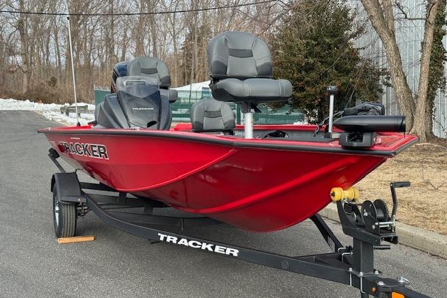 2026 Tracker Pro Team 175 Crappie Edition boat in vibrant red on trailer.
