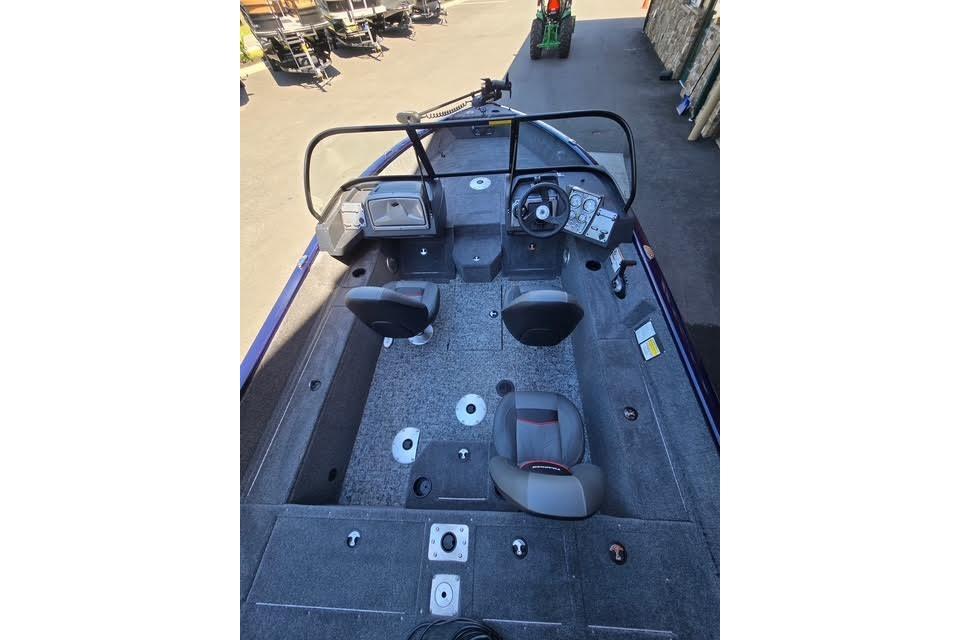 2026 Tracker Pro Guide V-175 WT boat interior with seating and steering console.