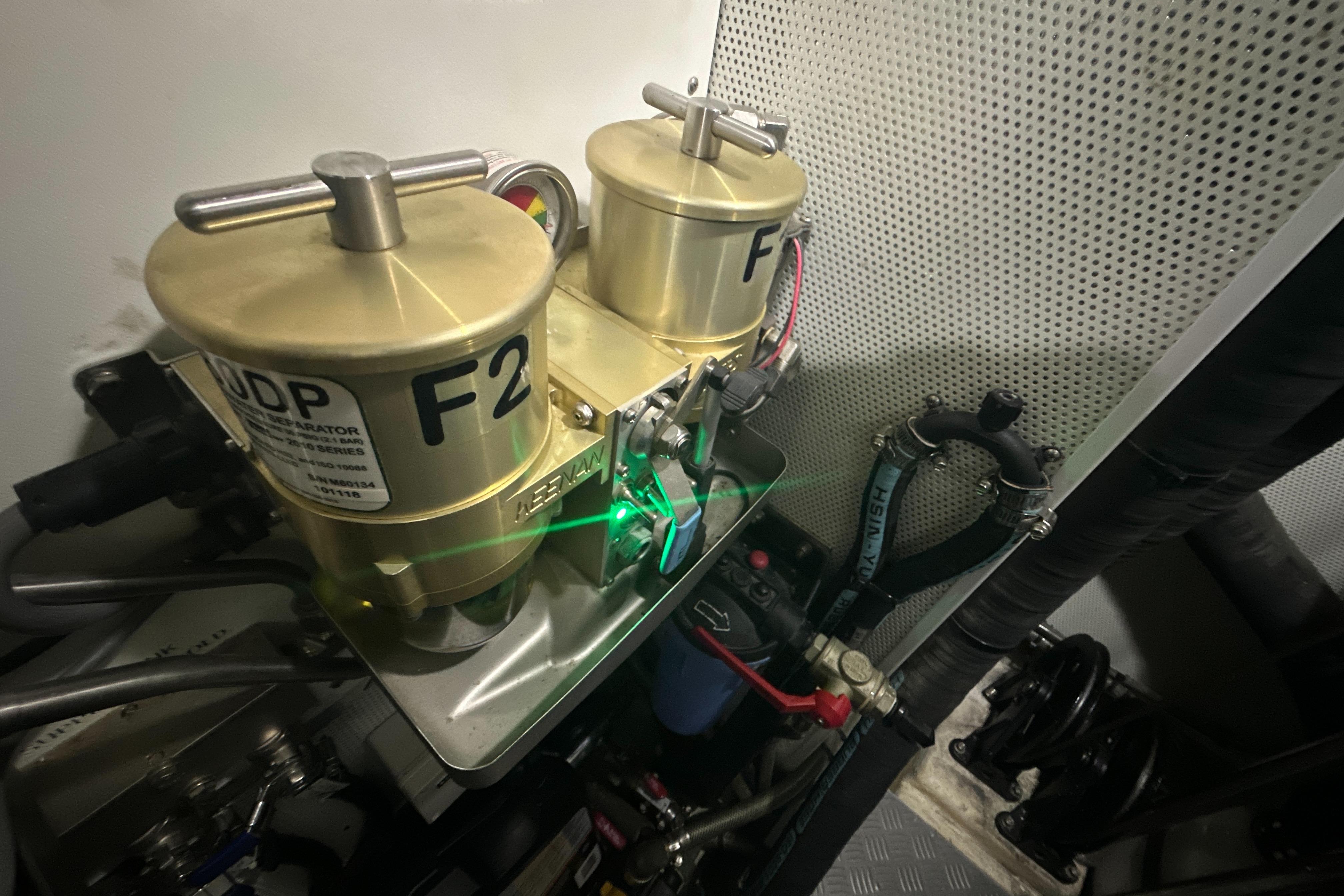 Engine room of a 2019 Kraken 50 yacht with dual fuel filters and piping.